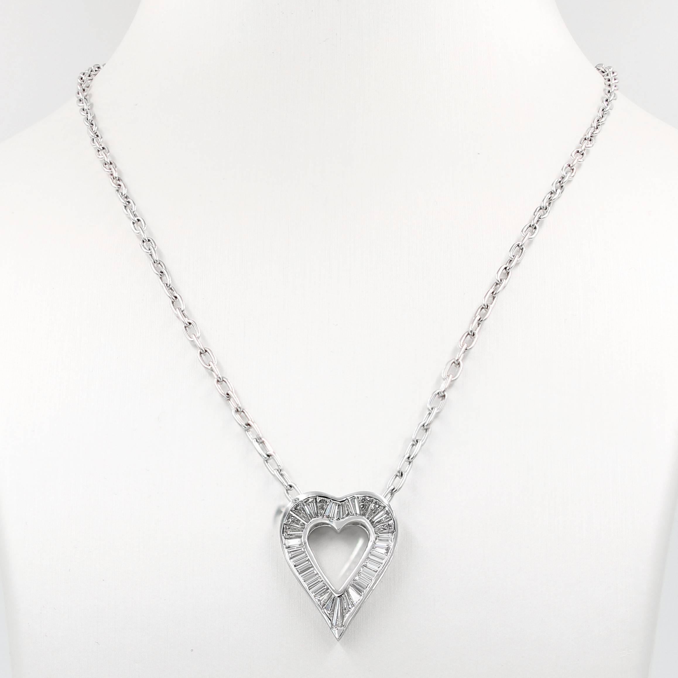 This elegant baguette diamond heart shape necklace in 18kt. white gold is a Lester Lampert original. It contains 32 baguettes = 2.40cts. t.w.  (the diamonds are G in color and VS clarity)

The piece is suspended from an 18kt. white gold oval link