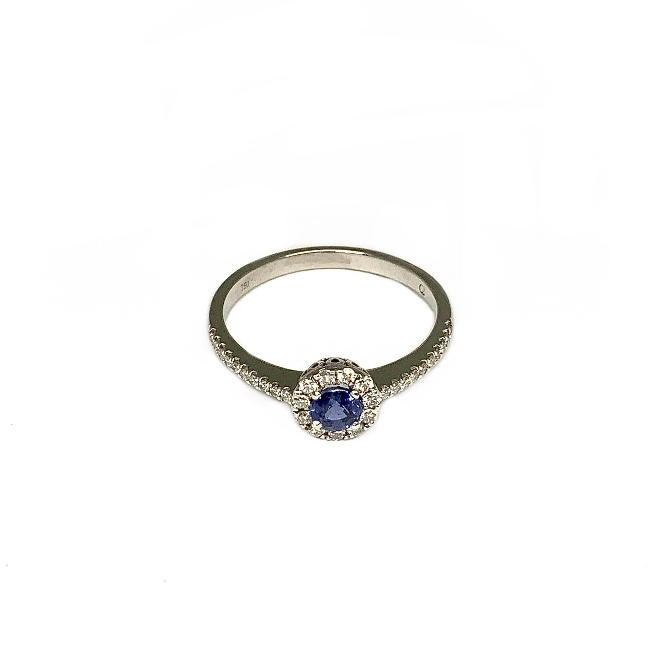 Material: Ring in white gold 750 18K polished width: 1.4mm - 2.0mm height: 1.1mm - 3.0mm with a blue Sapphire in brilliant cut 0.40ct. Ø: 4.0mm height: 3.0mm with 31 white Diamonds, 0.22ct. TWsi
Ring size: 56

Embrace the allure of eternal beauty