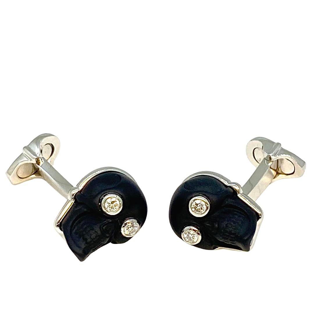 Material: Cufflinks in platinum 950 polished with 2 black onyx carved as skull with 4 white brilliant cut diamonds 0.19ct.
Weight: 20.45g

For the discerning gentleman who understands the importance of impeccable style, our Lesunja cufflinks are the