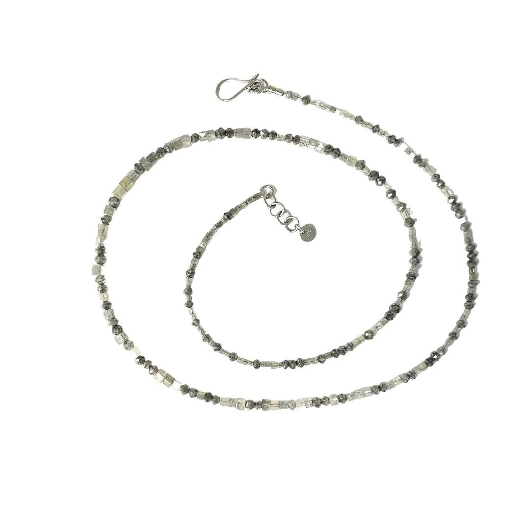 Necklace made from polished 18K/ 750 white gold with 222 square & briolette cut grey diamonds, 20.45ct., with lobster closure
Lengths: 43cm - 44cm

Indulge in the captivating allure of Lesunja Fine Jewellery's Grey Diamond Set – a masterpiece that