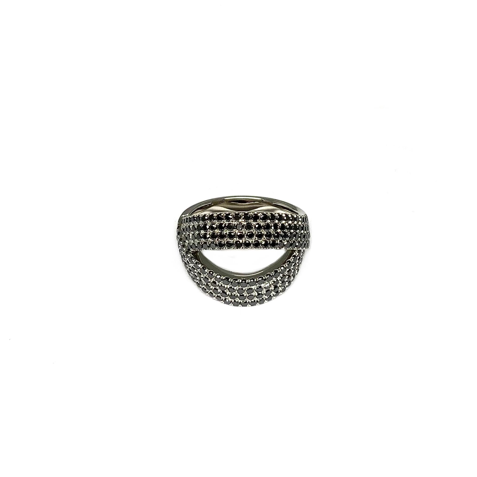 Ring in platinum 950 polished, head part width: 16.0mm height: 2.0mm. Ring band width: 5.3mm height: 1.7mm with 178 brilliant cut black diamonds 0.89ct. Ø: 1.0mm Ring size: 54

A meticulously crafted ring made from polished Platinum is a timeless