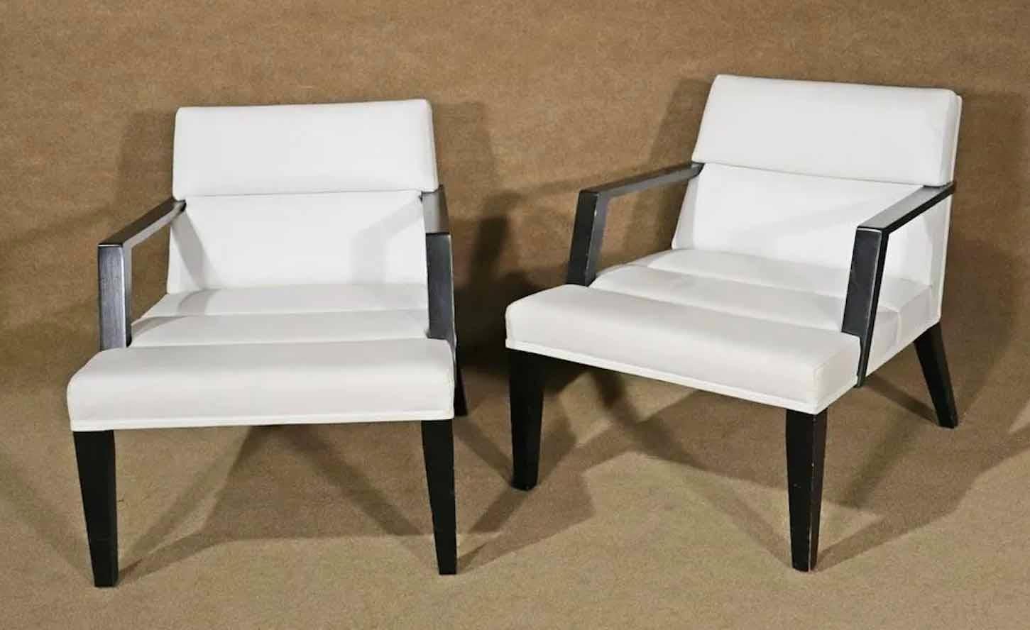 Pair of Mid-Century Modern style low chairs by the Bright Furniture Company. White leather over black wood frame. Simple and handsome design.
Please confirm location.