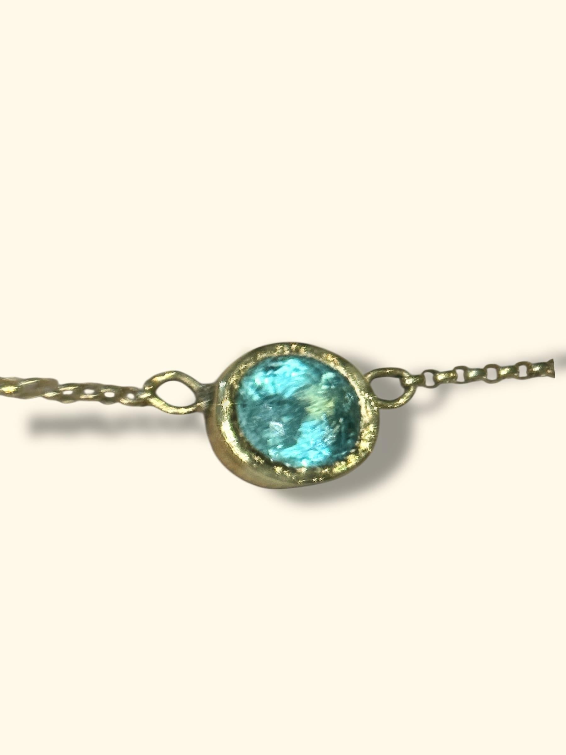 A unique and extremely elegant Paraibas Bezel Set Necklace that is gorgeous on its own or as a first or second layer necklace. It will look like you will be wearing a precious drop of ocean on your neck. 

 
1.075 Cts Stunning Glowy Vivacious Blue