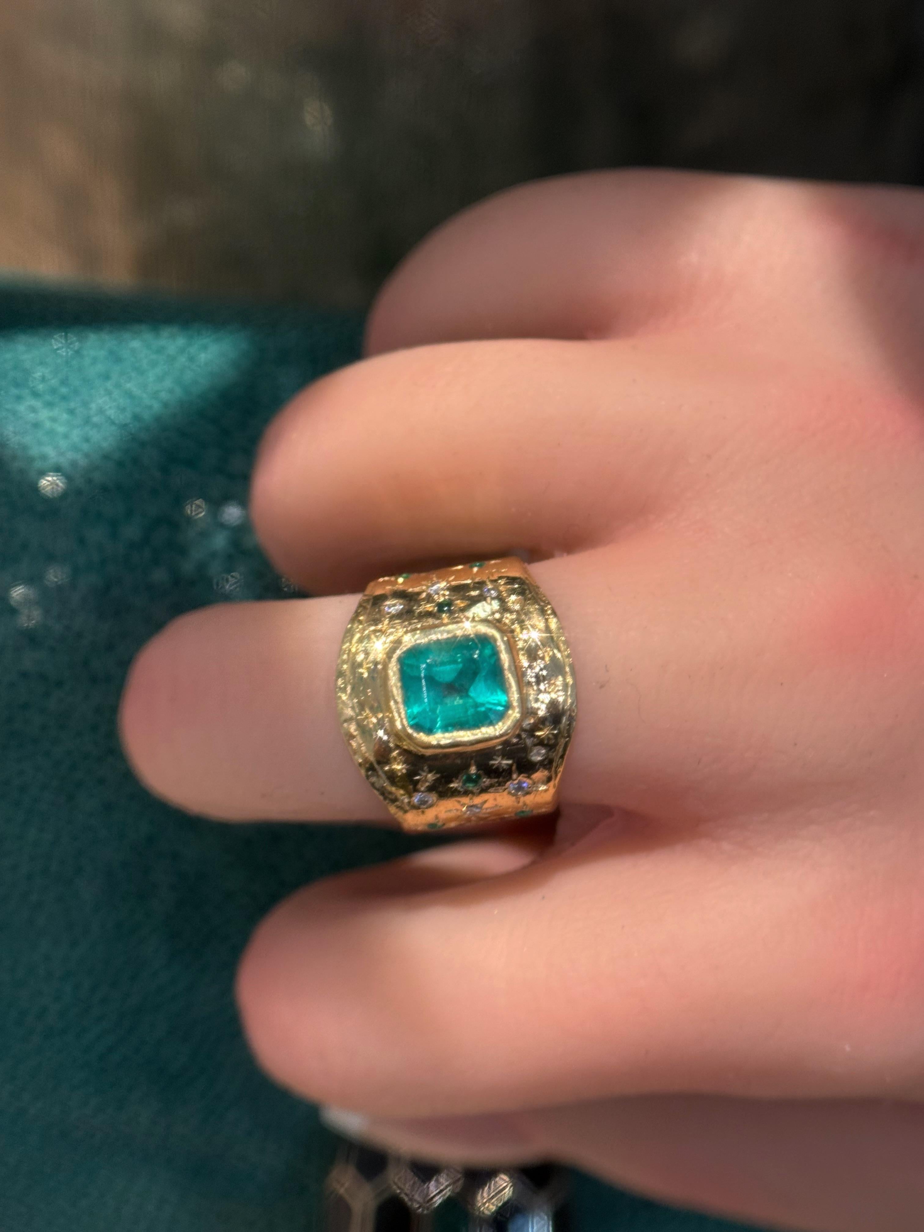 A perfectly imperfect handmade one of a kind statement Emerald Cigar ring that features a bezel set beautiful Colombian Emerald of 1.48 Cts certified by GIA as Minor Oil. 

A very elegant piece that is made to look stunning for any formal occasion
