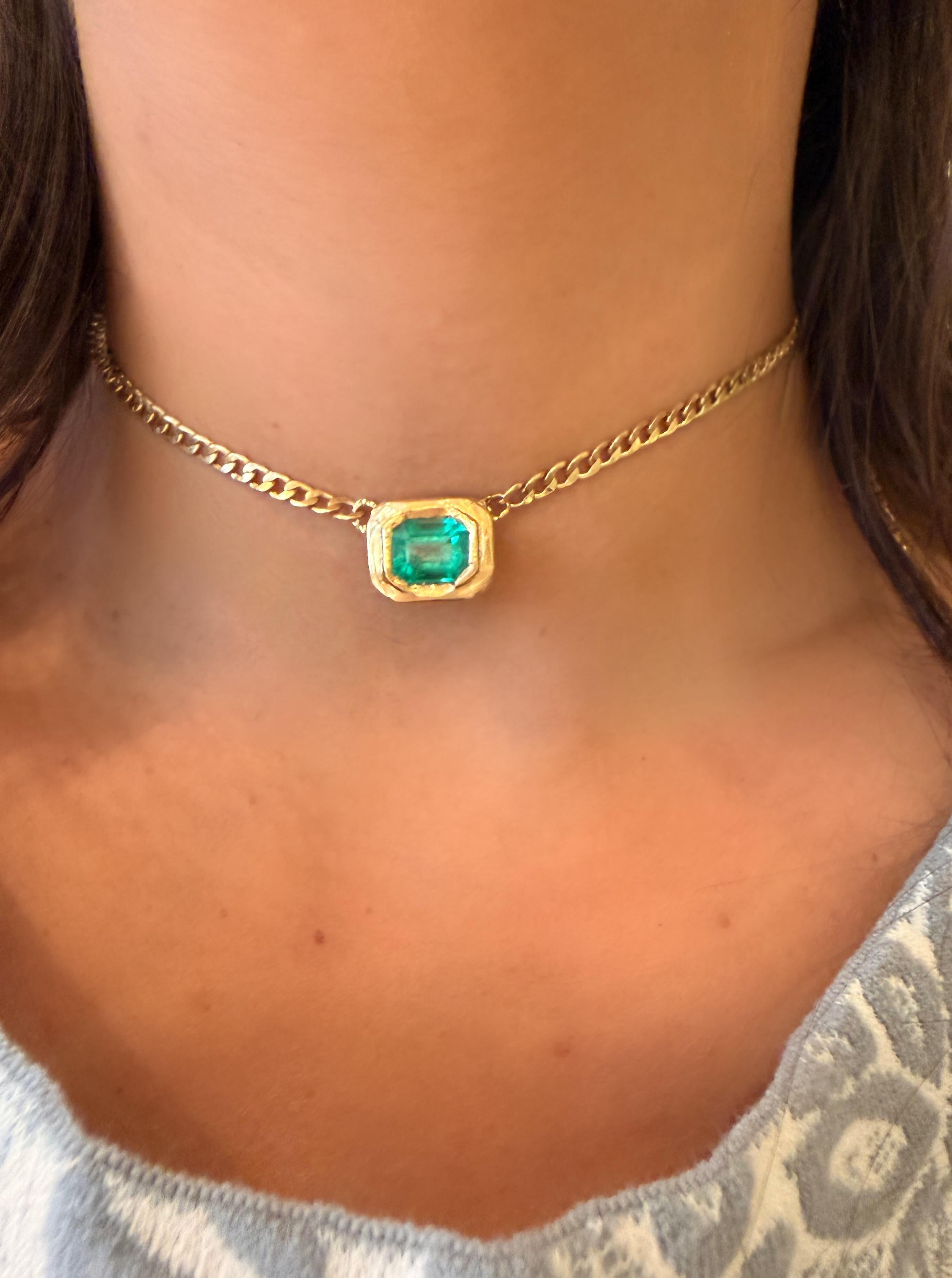 A vibrant blue green Colombian emerald necklace that shifts from choker to layered length with ease. The clasp hooks onto the chain links, giving you a beautifully adjustable fit to layer.

This is a very versatile piece that will elevate any
