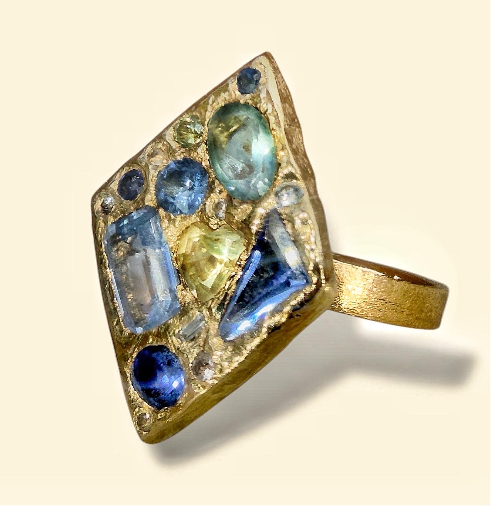 Dive into summer with this one-of-a-kind Abstract Art Ring, inspired by the enchanting blue-green hues of the sea. Perfect for ocean lovers and those who cherish coastal vibes, this unique piece combines elements of cubism and oceanic influences,