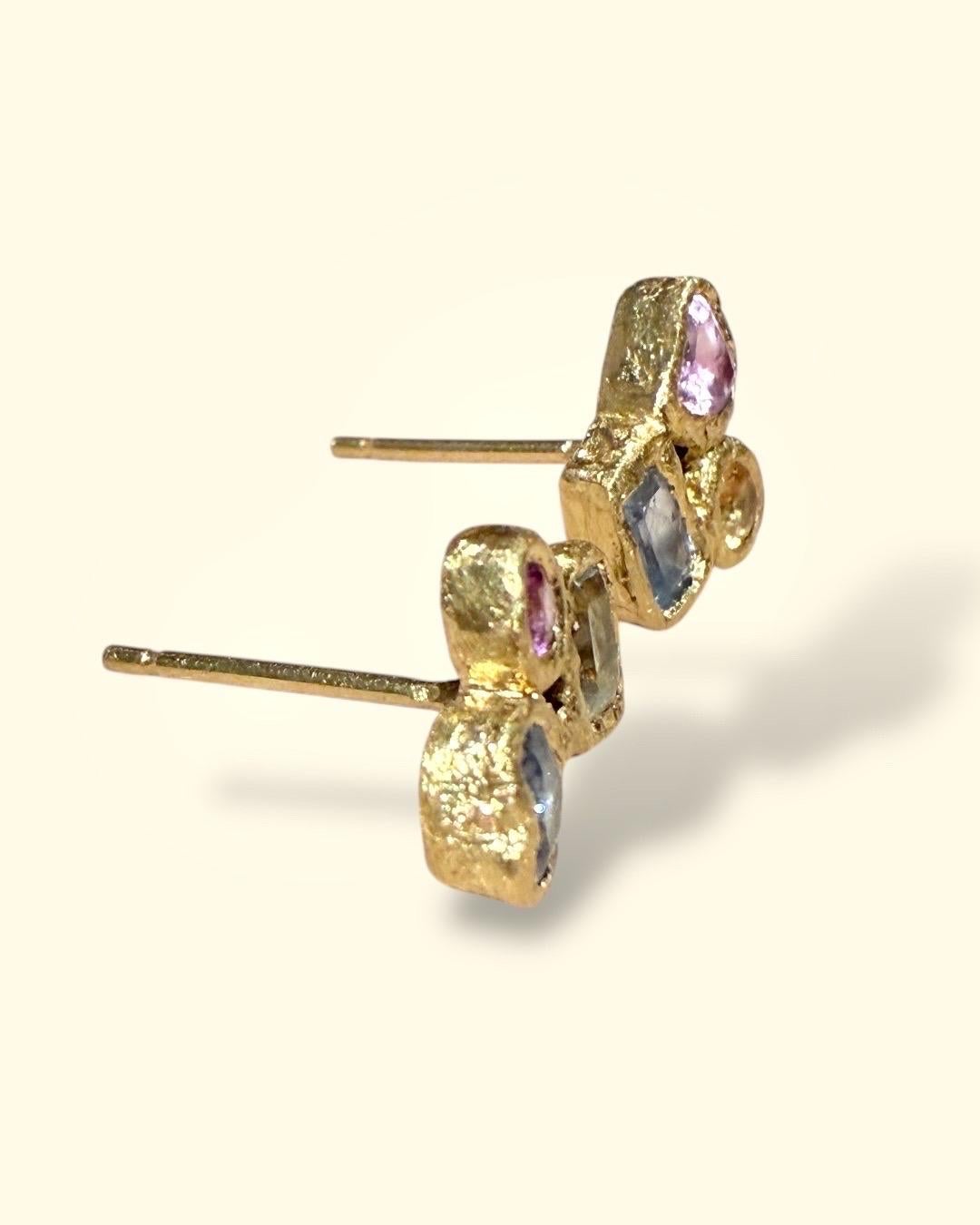 Unique 18 Ct Gold Heart, Round, and Rectangular Abstract Art Sapphire Love Studs. Perfect for any occasion, they will add a splash of color to your look.

Easy to wear
Playful and Precious
Mismatched Pair
Recycled 18 Ct Yellow Gold
Bezel Set
Brushed
