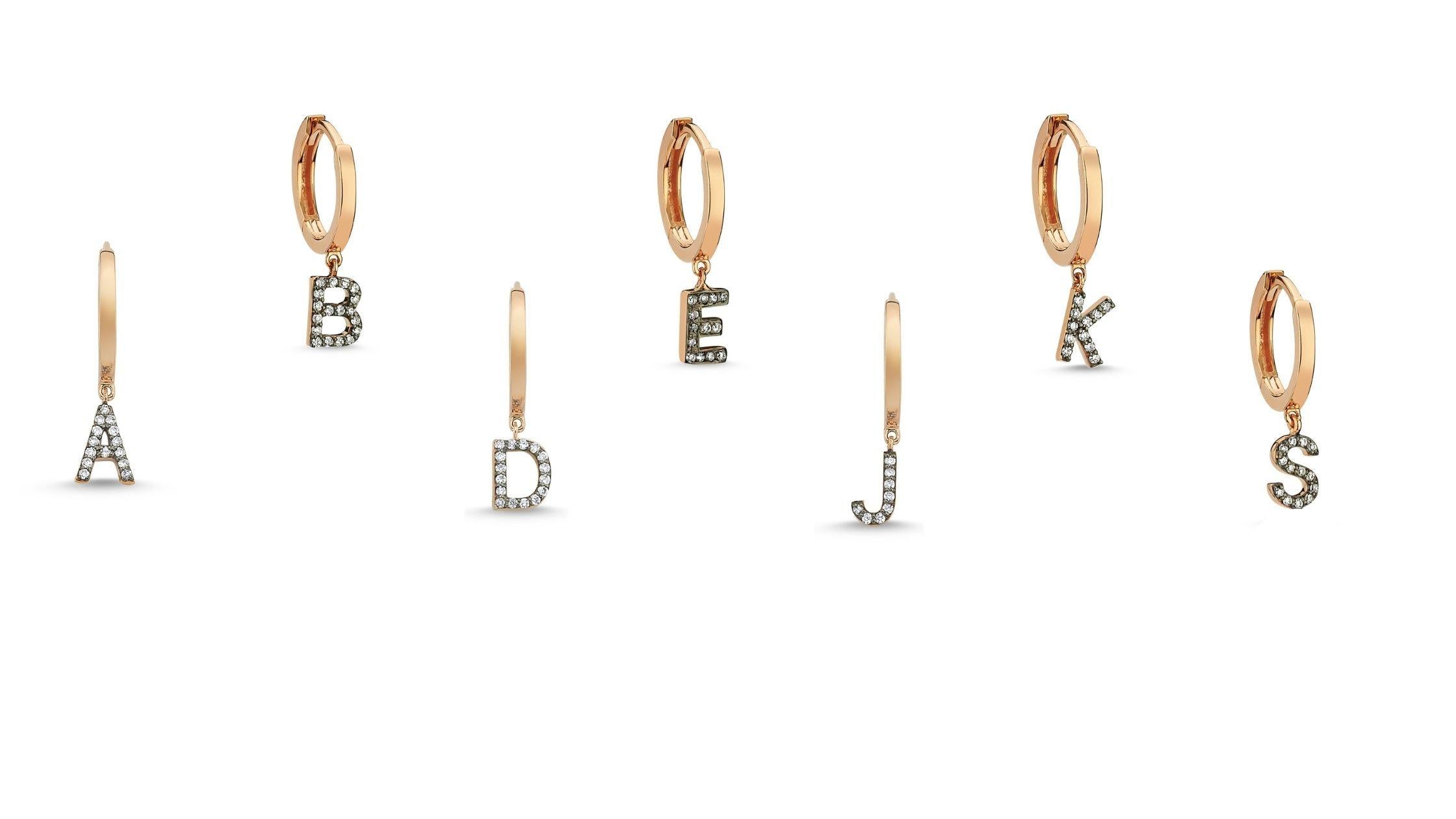 Letter A (single) 14k rose gold earring with white diamond by Selda Jewellery

Additional Information:-
Collection: Letter Collection
14k Rose gold
0.05ct White diamond
Letter height 1cm