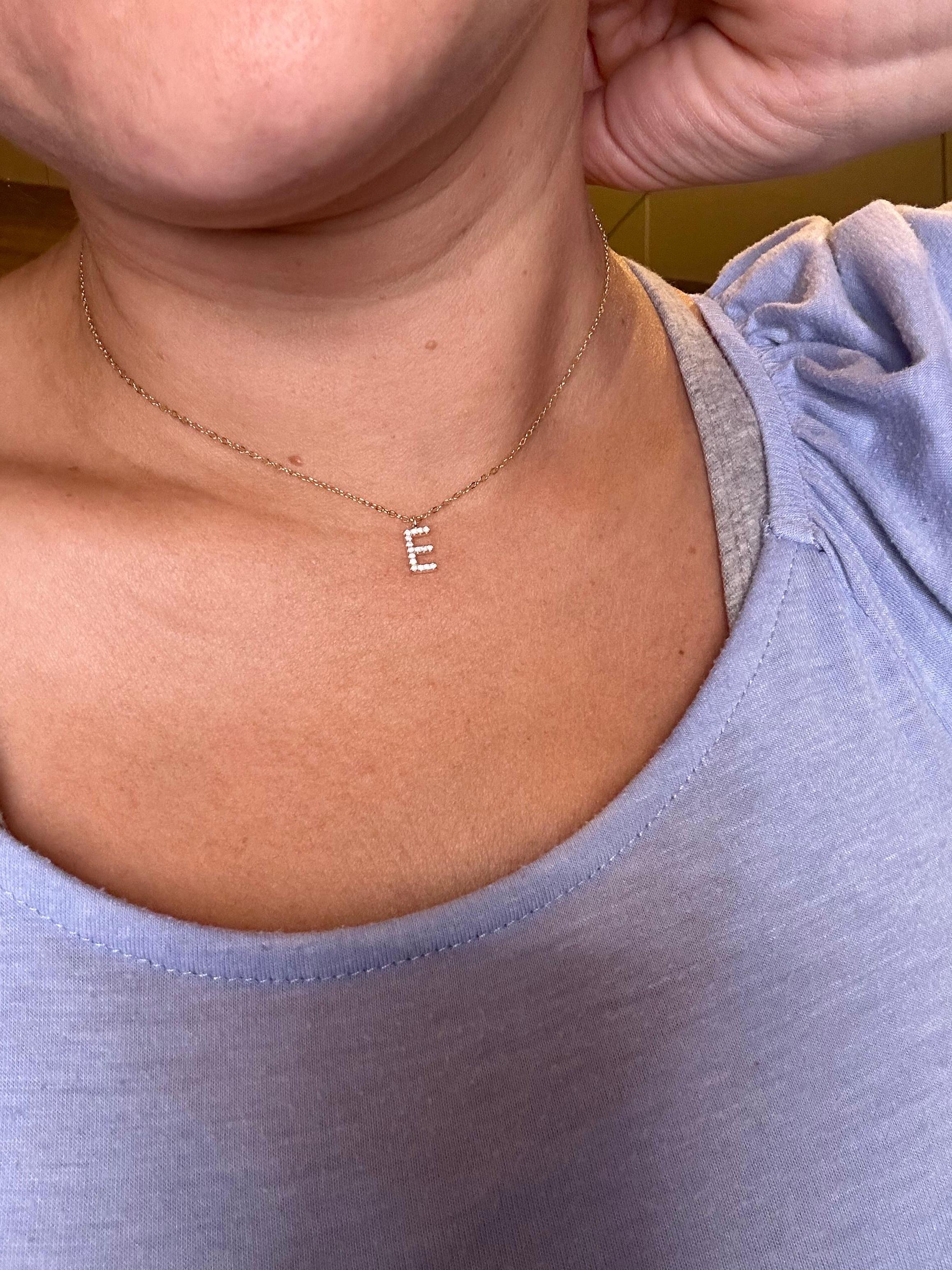 Modern diamond pendant necklace with letter E made in 18KT yellow gold with natural diamonds totalling 0.50ct, diamnonds are VS clarity and F color, the sparkle is unreal on this pendant, its dainty and made with such a amazing craftsmanship!

Metal