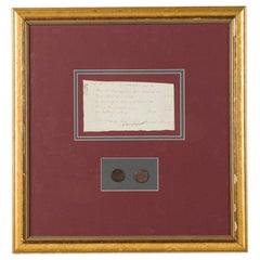 Letter Fragment and Antique Coins in Burgundy Matting and a Gilt Frame