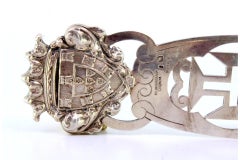 Letter opener in cut silver with embossed coat of arms at the top