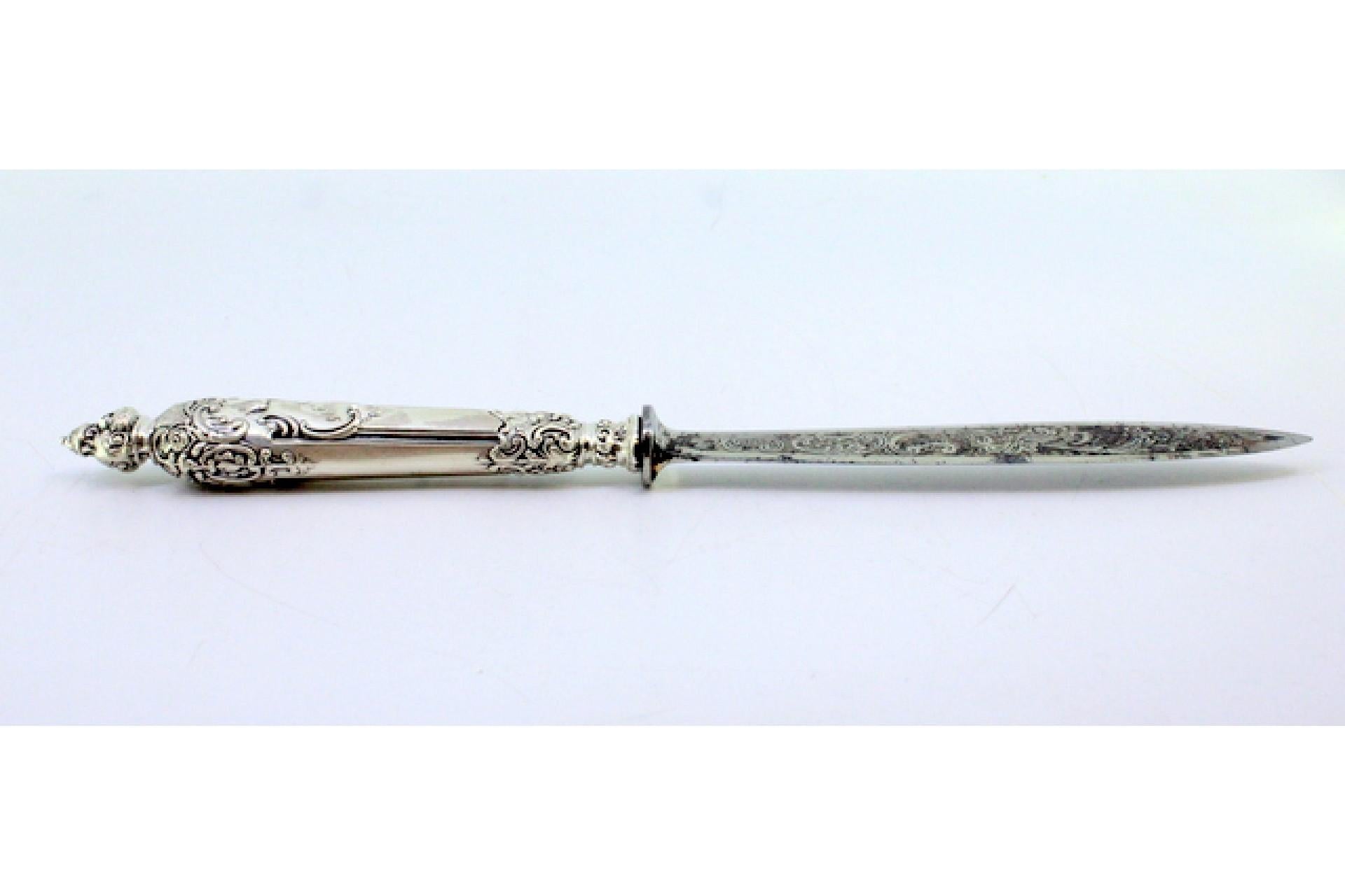 20th Century Letter opener in the shape of a knife with an embossed silver handle and large m For Sale