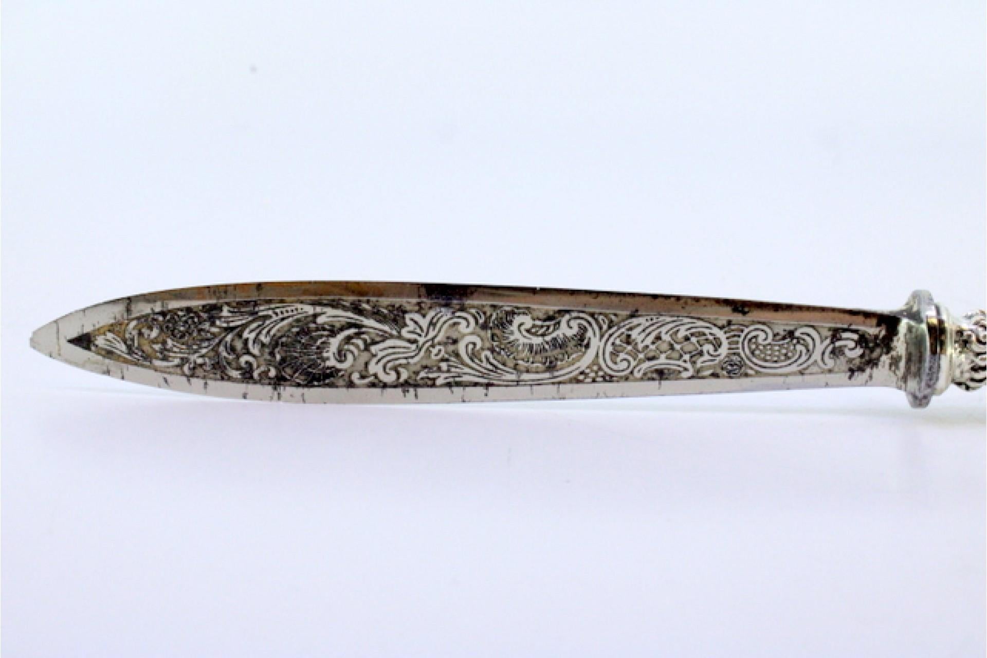 Letter opener in the shape of a knife with an embossed silver handle and large m For Sale 1