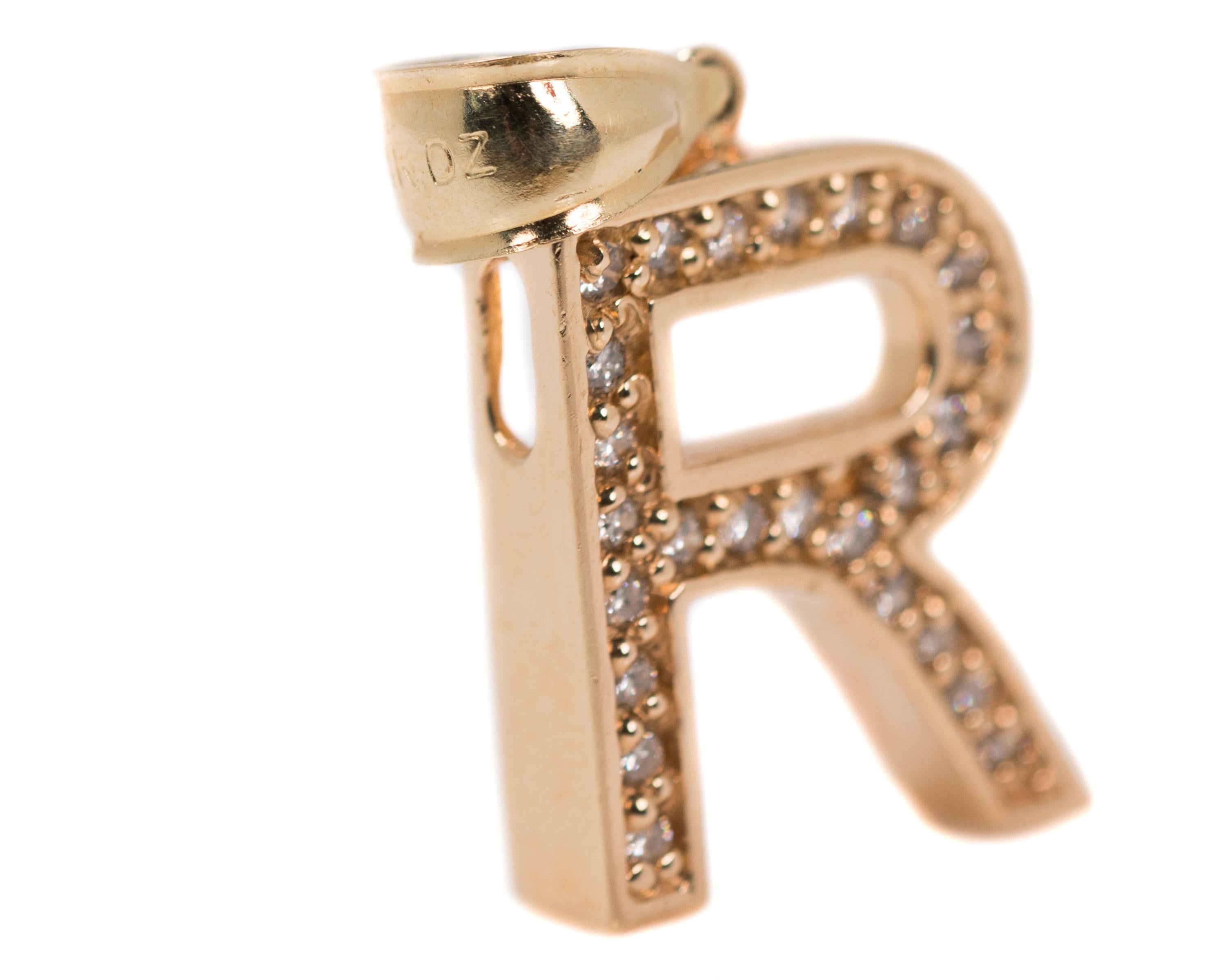 1990s Initial R Pendant Charm - 14 Karat Yellow Gold, Diamonds

Features:
0.33 carats Diamonds
14 Karat Yellow Gold Setting
Fixed Bail
Openings on upper and side edges of the upper corner for a chain or jump ring to wear as a charm
Charm measures 24