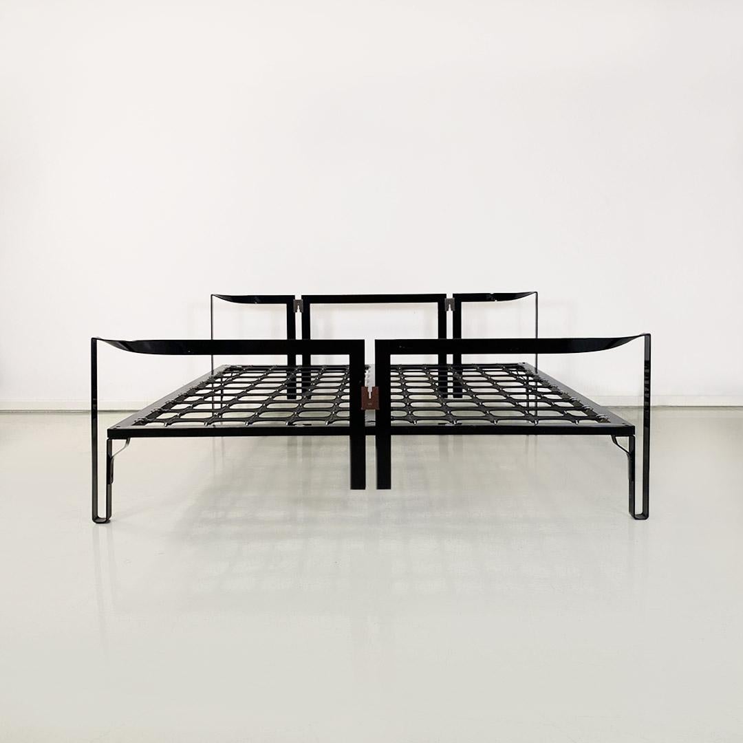 Metal double bed mod. Vanessa with all-black polished metal frame, flat section, with curved ends on headboard and footboard and legs with curved support. Mesh composed of patented elastic rubber band manufactured by Oggioni, anchored around the