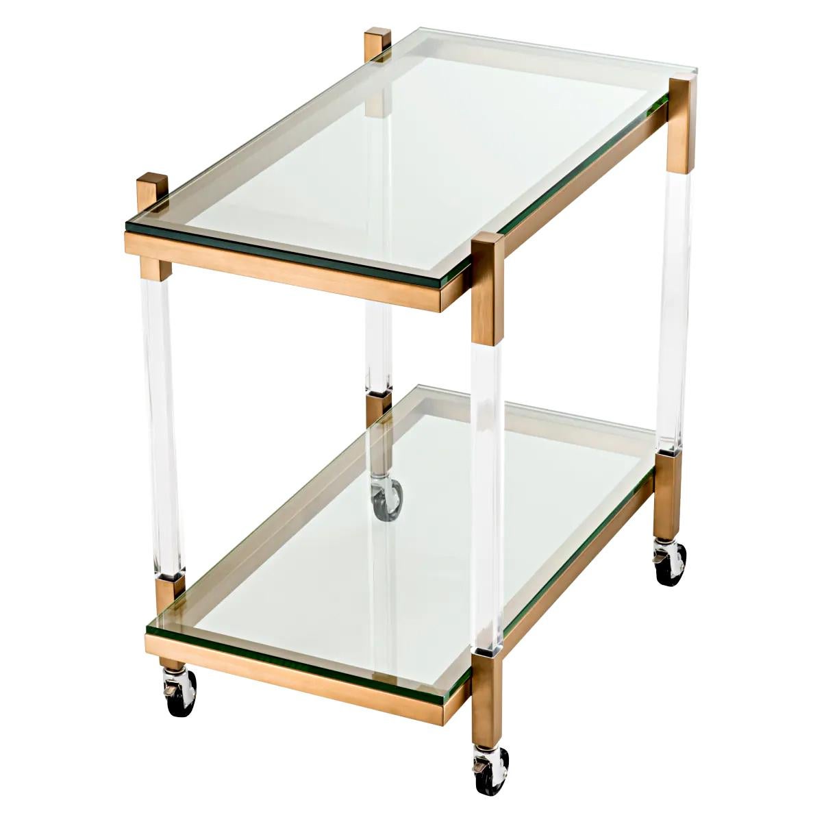 Chariot Letton avec structure en acier inoxydable
en finition laiton brossé et avec 2 plateaux en verre acrylique. 
Chariot avec 4 roulettes rotatives.

