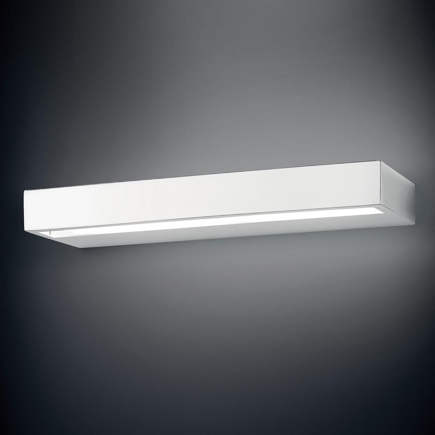 Designed in 2004 by Design Works Studio (Tonetto and Lazzati), Alias wall lamp is a beautiful, minimal piece with clean lines. Its sleek design and integrated LED light source is perfect for a wide array of projects. Available in brushed nickel,