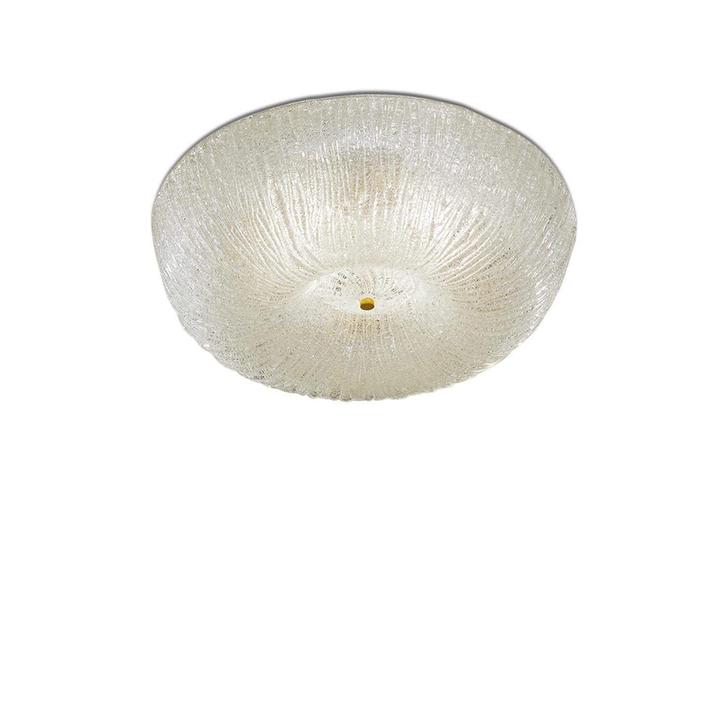 Campiello comes from the historical archives of Leucos, updating the traditional use of Graniglia crystal to create a beautiful ceiling lamp. Graniglia Glass is made by pressing fracco (crystal shards) into the backside of hand-cast glass. The