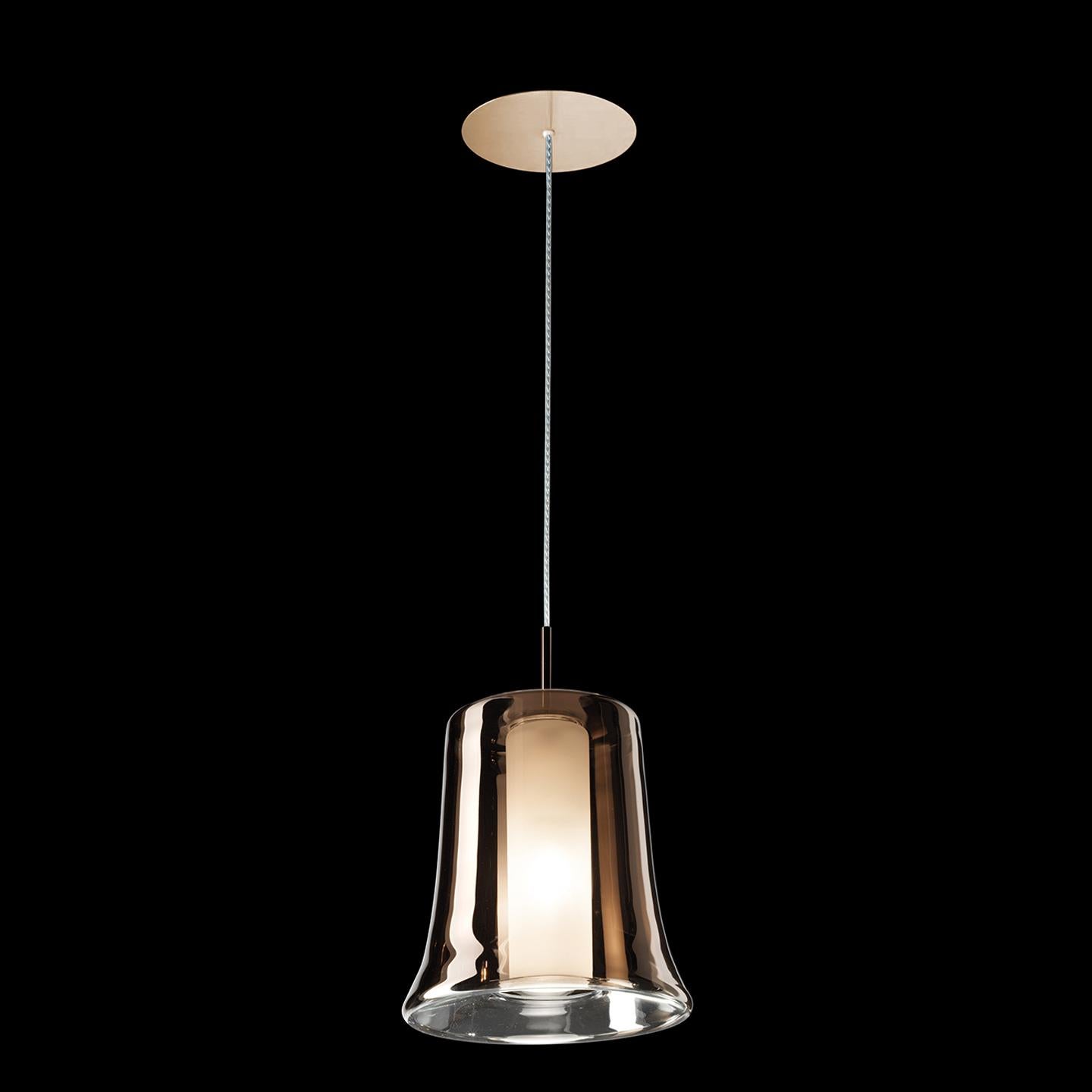 The Cloche collection was designed by Danilo De Rossi in 2013 using a clever, two-tone glass layering technique that transforms the Cloche’s simple form into a complex and dynamic lighting statement. Cloche is composed of a clear glass exterior