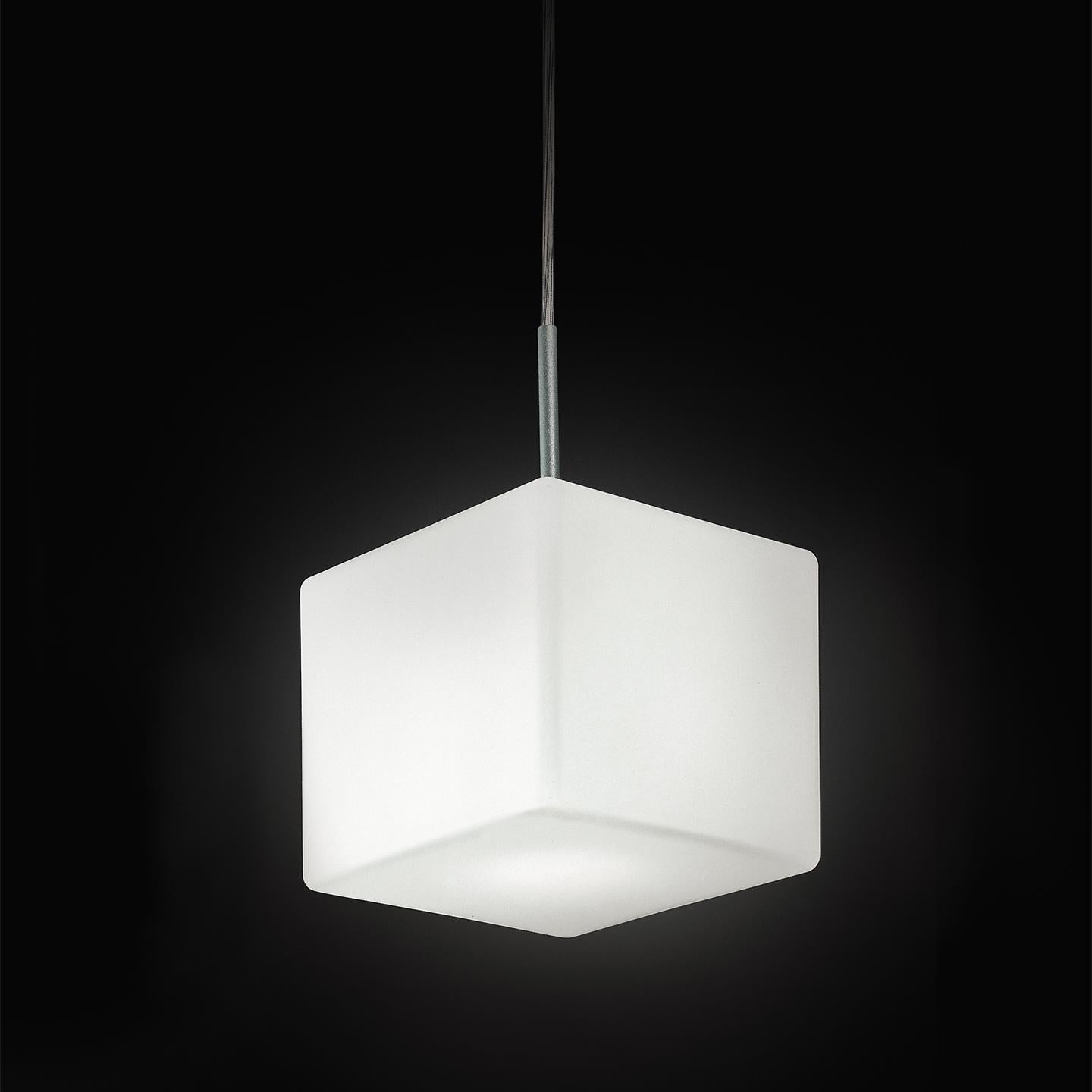 The Cubi pendant, designed in 2000, is an icon of Leucos. Its cubic form is surprising for handmade glass, which makes it a delightful lamp. Its hand blown satin white diffuser is made of multiple layers of glass to create a rich, white look. This