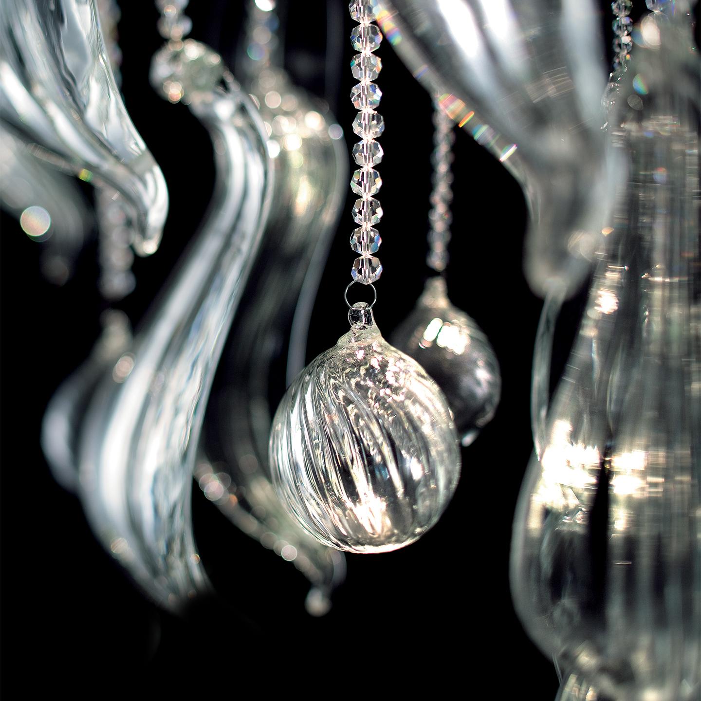 The Elysée Ceiling Lamp evokes the traditional style of a Murano chandelier, but with a modern twist. Designed by Marina Toscano, Elysée is composed of translucent, hand blown Italian glass tendrils that break out into sculptural, LED-illuminated
