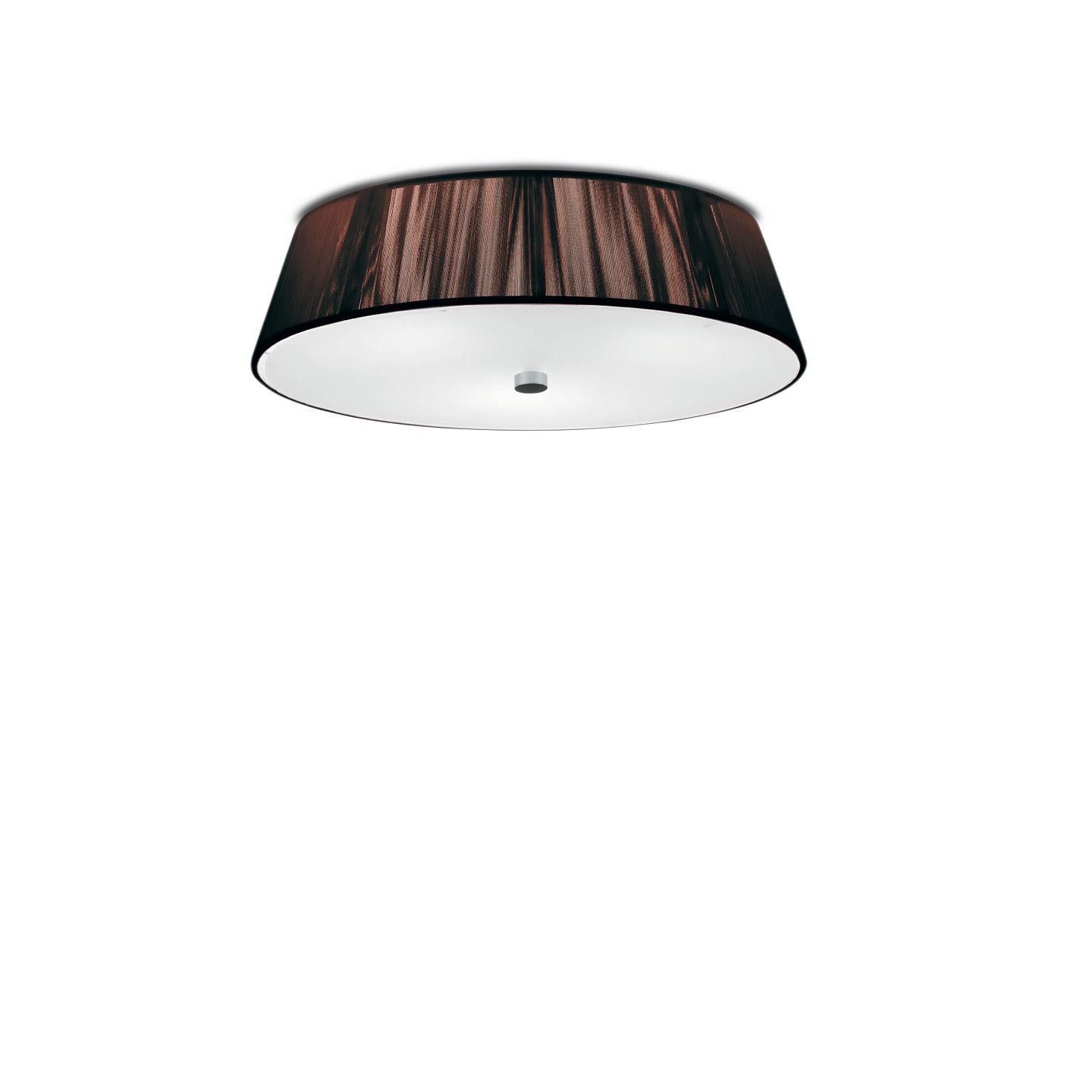 The Lilith ceiling lamp is an elegant lighting solution with a stunning light effect created by threading thin string in a consistent pattern across the shade. As you engage it from different viewpoints, the light pattern shimmers and changes. The