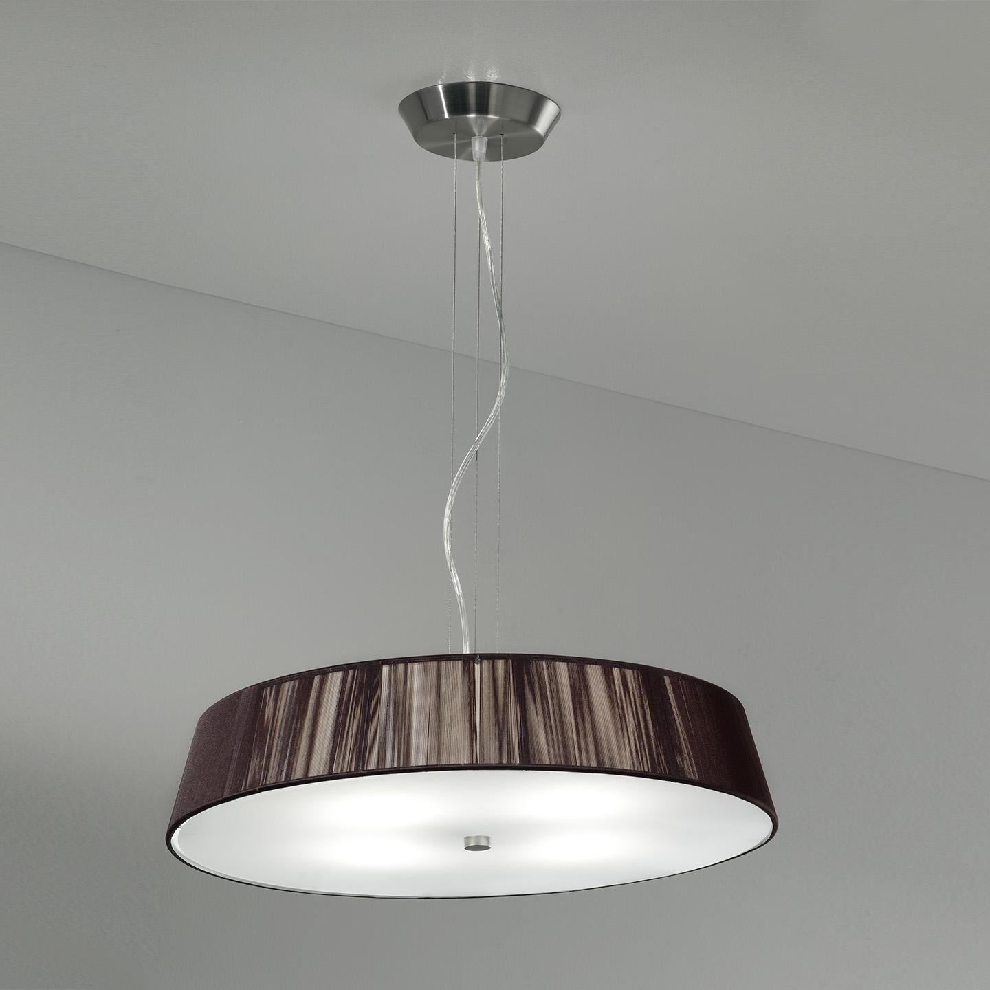 The Lilith Pendant is an elegant lighting solution with a stunning light effect created by threading thin string in a consistent pattern across the shade. As you engage it from different viewpoints, the light pattern shimmers and changes. The result