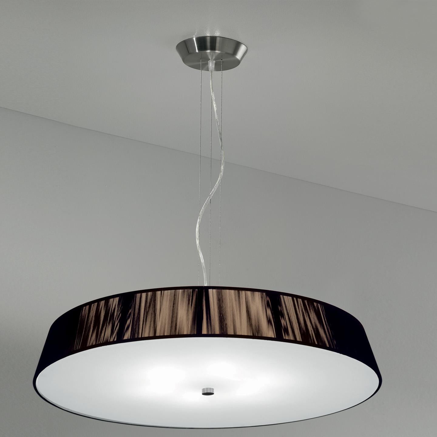 The Lilith pendant is an elegant lighting solution with a stunning light effect created by threading thin string in a consistent pattern across the shade. As you engage it from different viewpoints, the light pattern shimmers and changes. The result