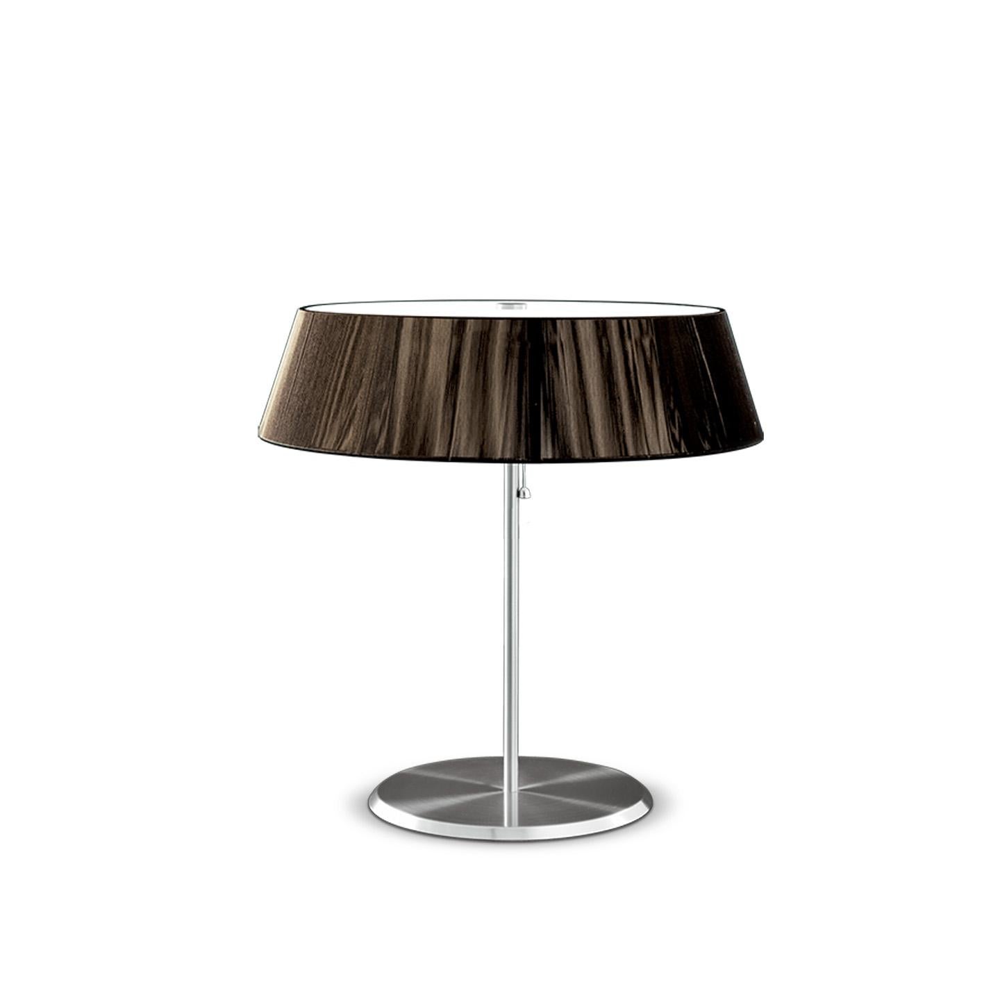 The Lilith table lamp is an elegant lighting solution with a stunning light effect created by threading thin string in a consistent pattern across the shade. As you engage it from different viewpoints, the light pattern shimmers and changes and the