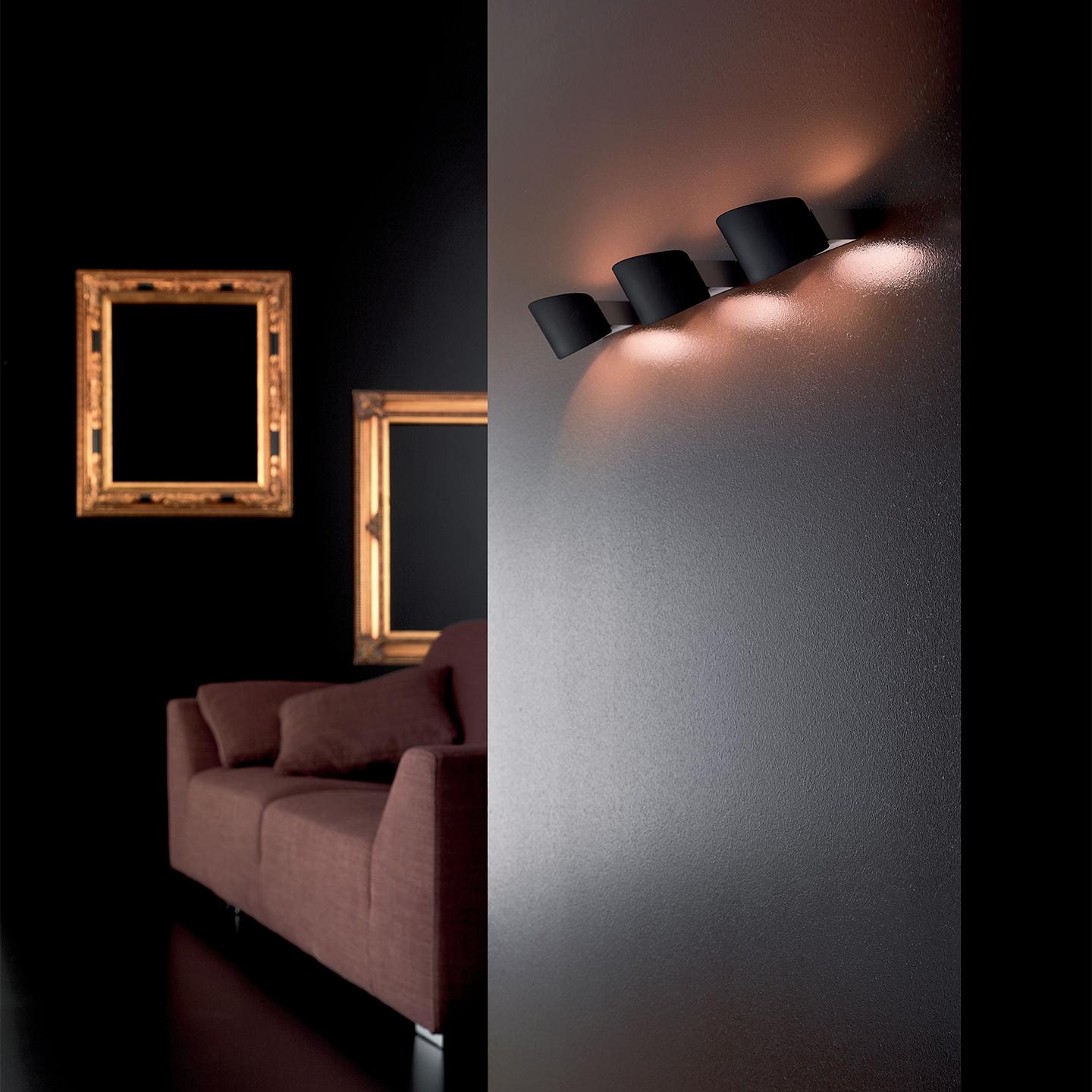 Link is a versatile wall lamp designed by Mauro Marzollo in 2005. It features a blown glass diffuser finished in satin and is available in white, red or black. A metal structure in brushed nickel supports the glass diffuser. Two size options to meet