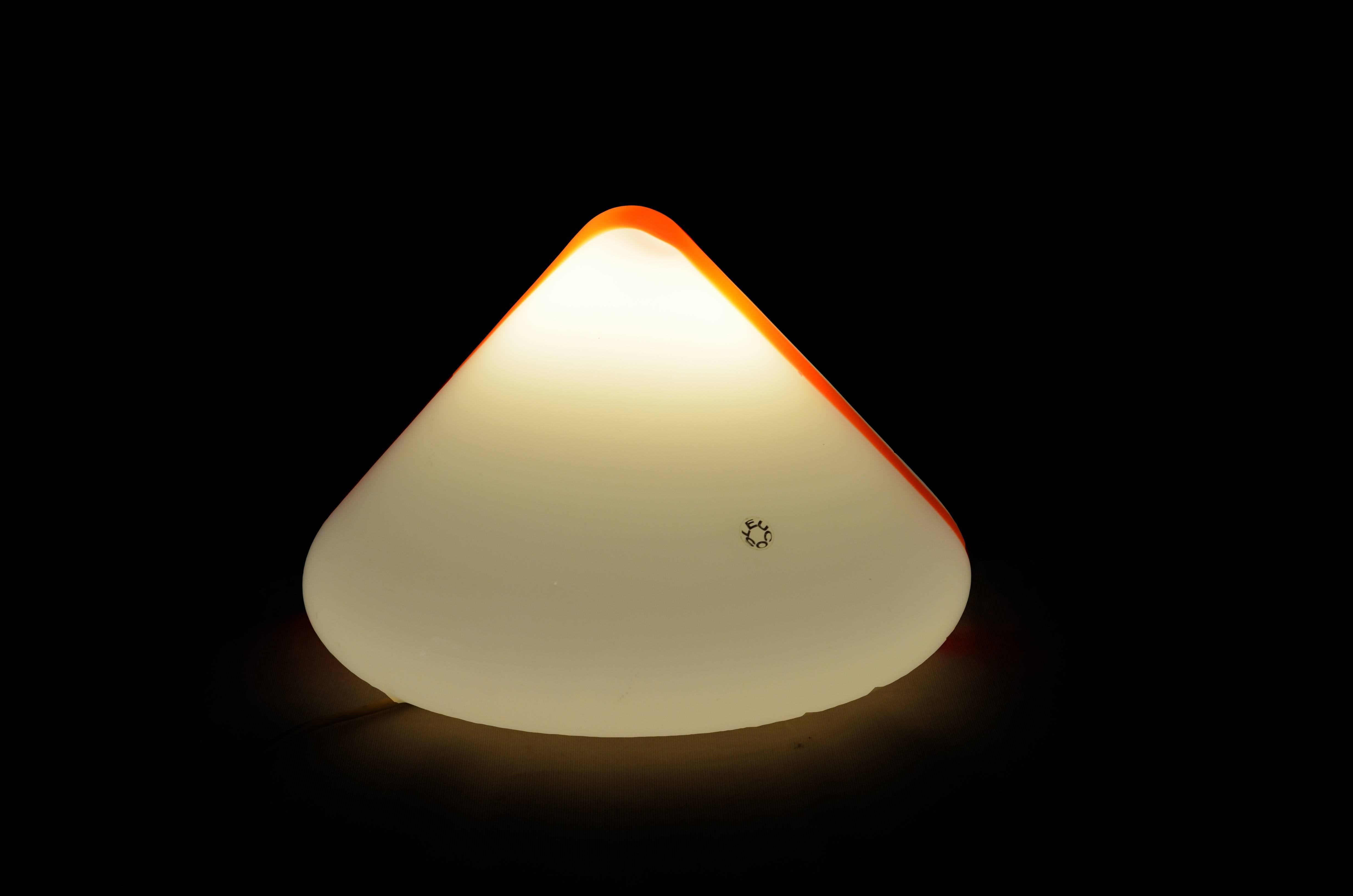 Leucos pyramidal white and orange blown glass table or floor lamp, 1970s

This pyramidal shape, white and orange blown glass lamp is marked Leucos. It is Italian from 1970s. The lamp is in perfect condition, it comes with its original wiring and