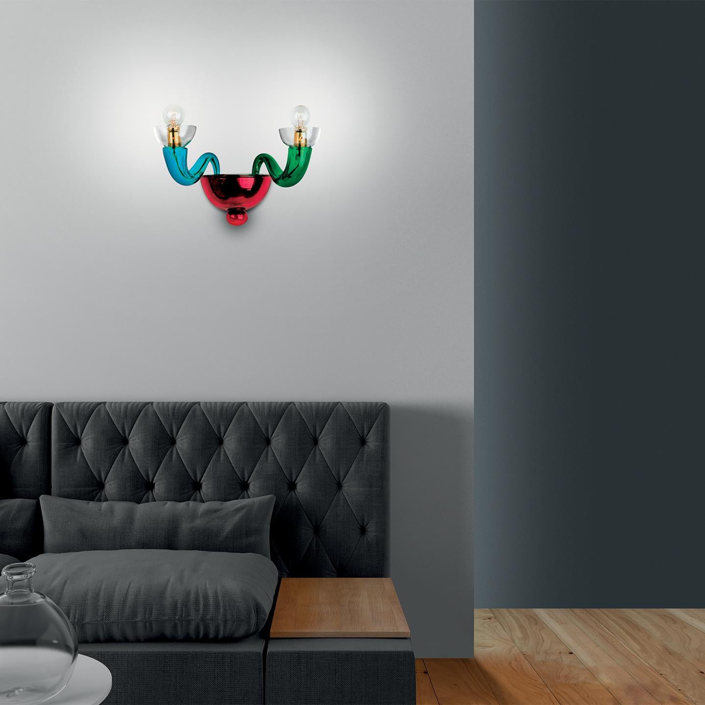 The Serenisima wall light is a colorful lamp that perfectly mixes history, handmade craftsmanship and playfulness. Serenisima’s design comes from the historical archives of Leucos and is an iconic example of bright, colorful Venetian glass used in a