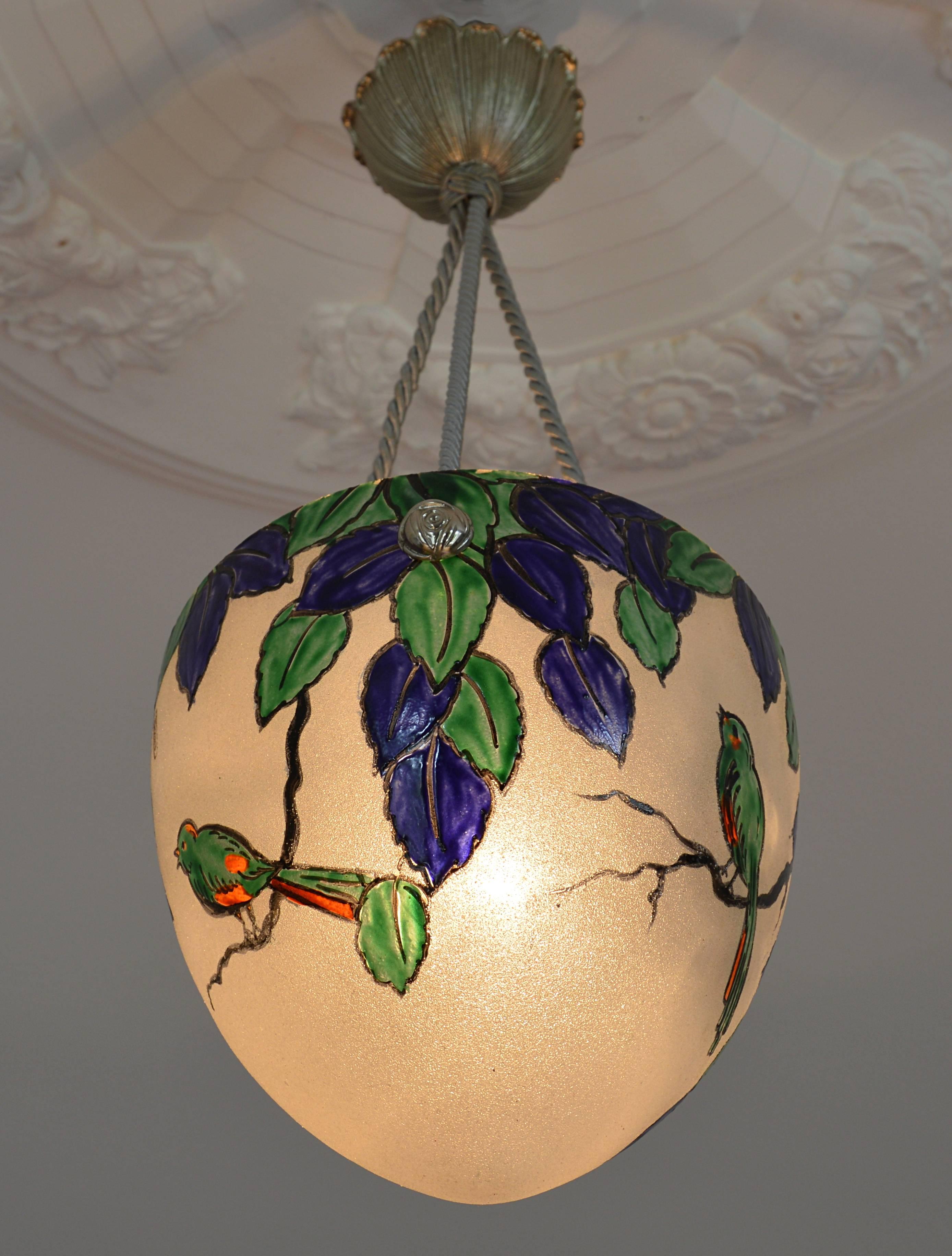 French Art Deco pendant by Leune, 28bis rue du Cardinal Lemoine, Paris, France, circa 1925. Granite glass shade with enameled pattern. Three birds in a tree. The bronze and tissue fixture is a new reproduction of original 1920s fixture, to make this
