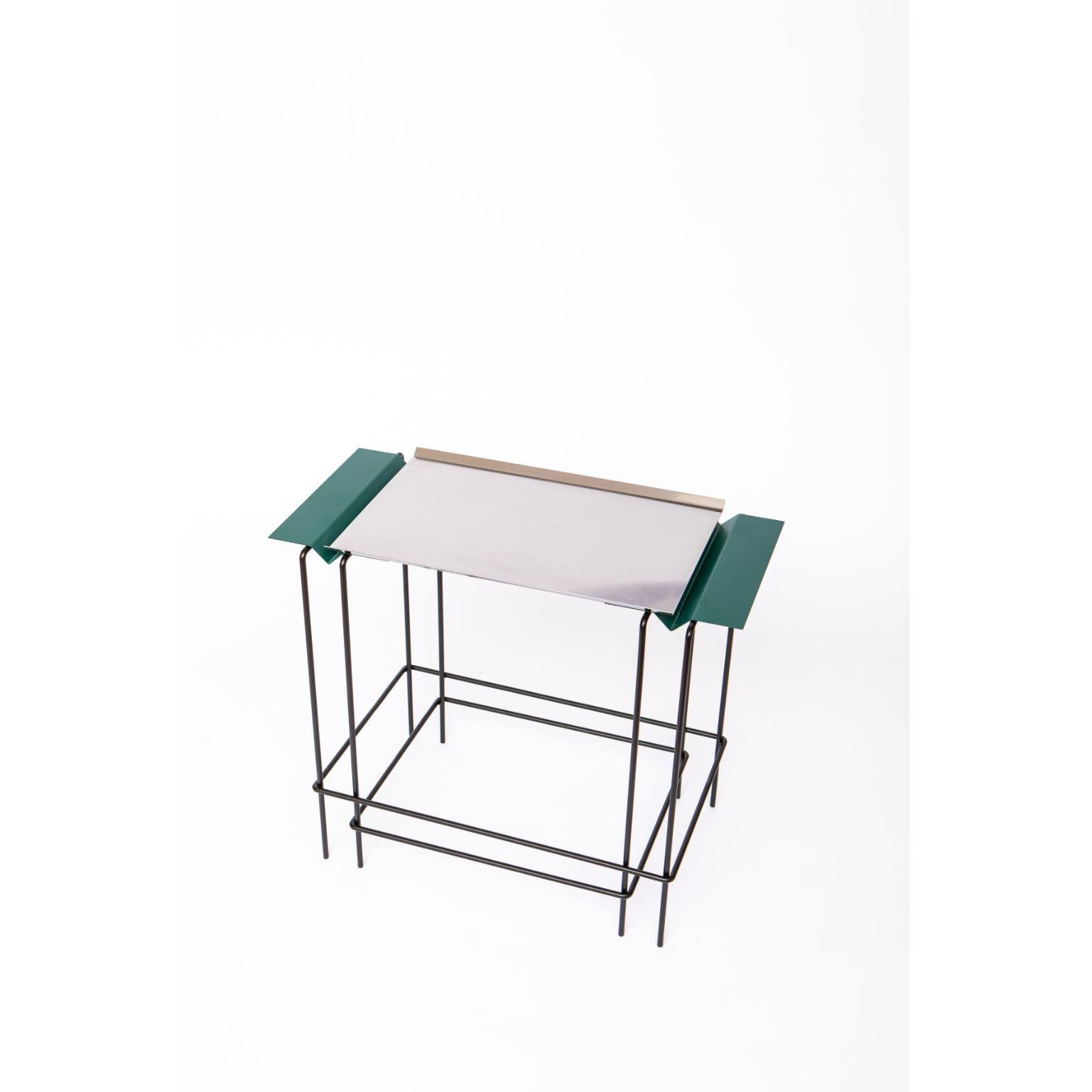 Leva 50 - Table by Alva Design
Materials: Painted Metal, Stainless Steel
Dimensions: 60 x 50 x 32 cm

ALVA is a furniture and objects design office, formed by brothers Susana Bastos, artist and designer, and Marcelo Alvarenga, architect. Their