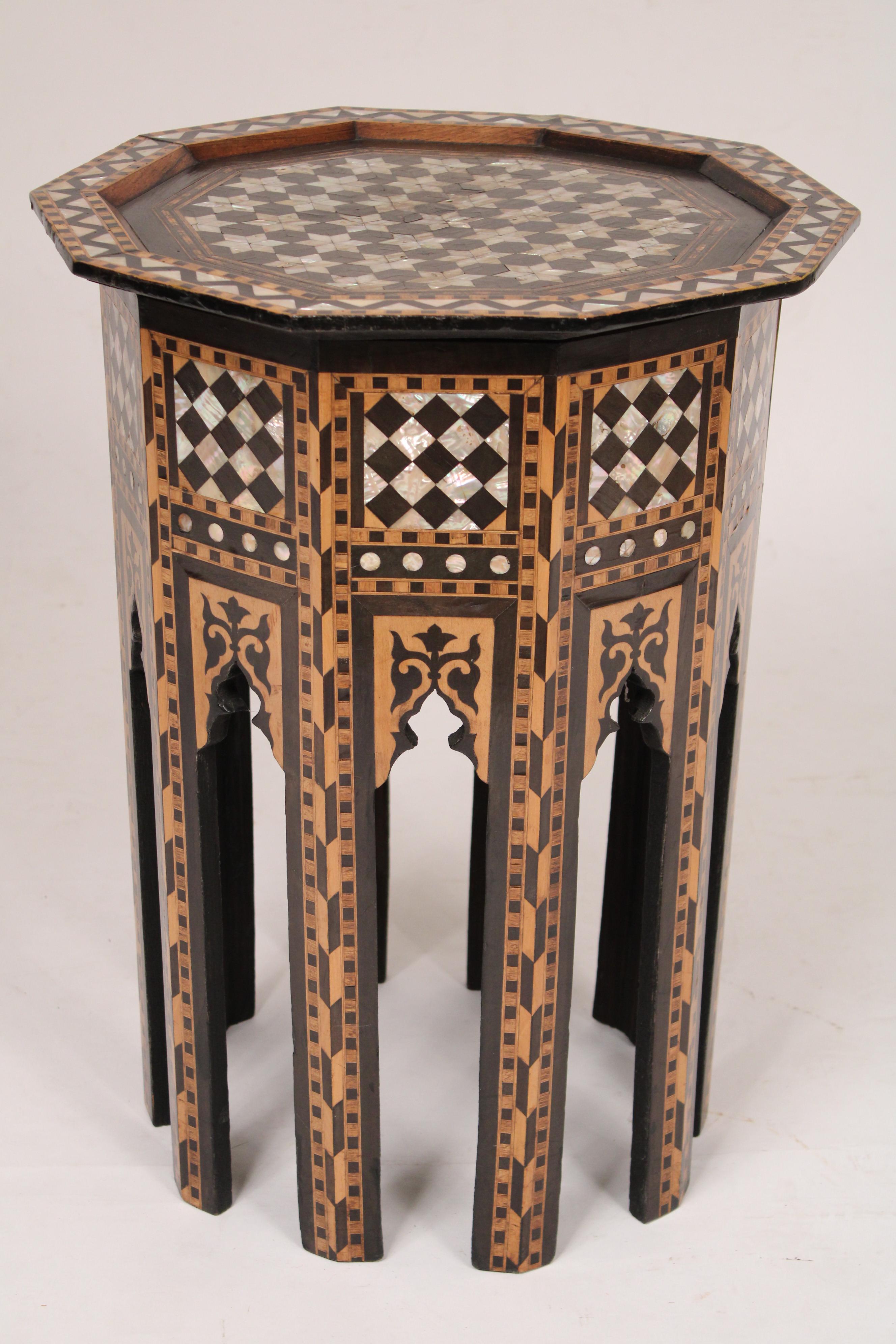 Levantine mother of pearl inlaid decagon shaped occasional table, circa 1980. A tremendous amount of time and craftsmanship went into making this table. With exquisite mother of pearl and wood inlays.