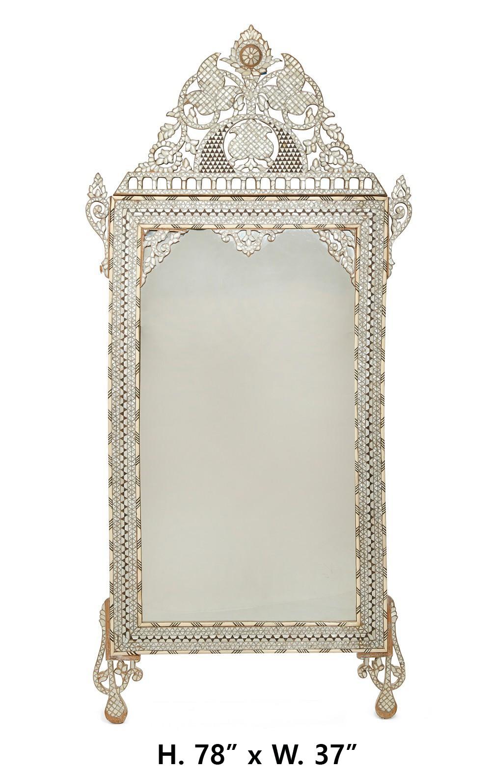 Outstanding Levantine mother of pearl,bone and pewter inlaid hardwood mirror, possibly Moorish.
Late 19th century. 
The elaborate arabesques solid mirror is intricately encrusted with lustrous mother of pearl with sophisticated details, each piece