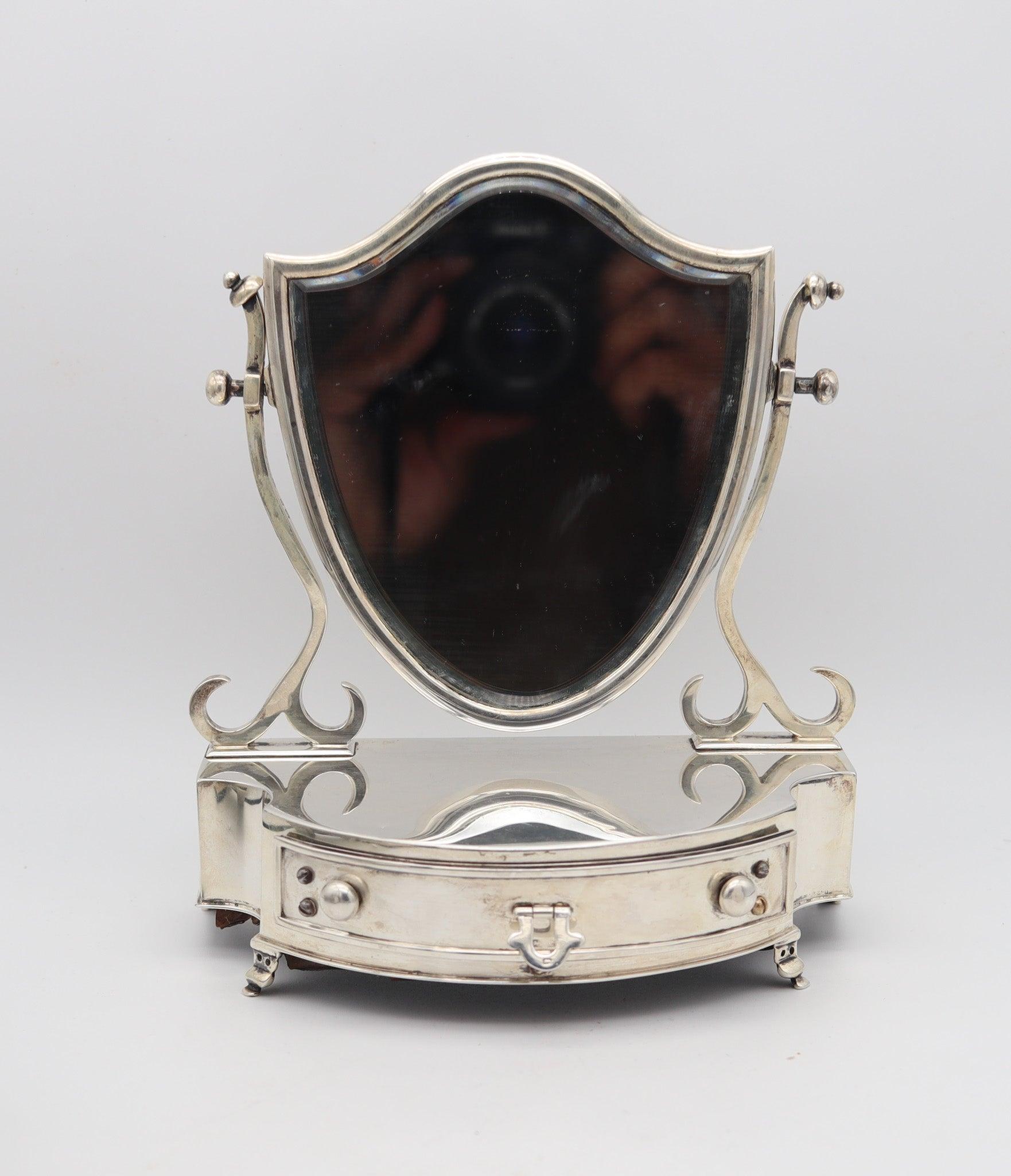 Decorative chest with mirror designed by Levi & Salaman.

This is a beautiful and very decorative miniature chest created in Birmingham England by the silversmiths of Lévi & Salaman, back in 1902. The miniature chest was carefully crafted with parts