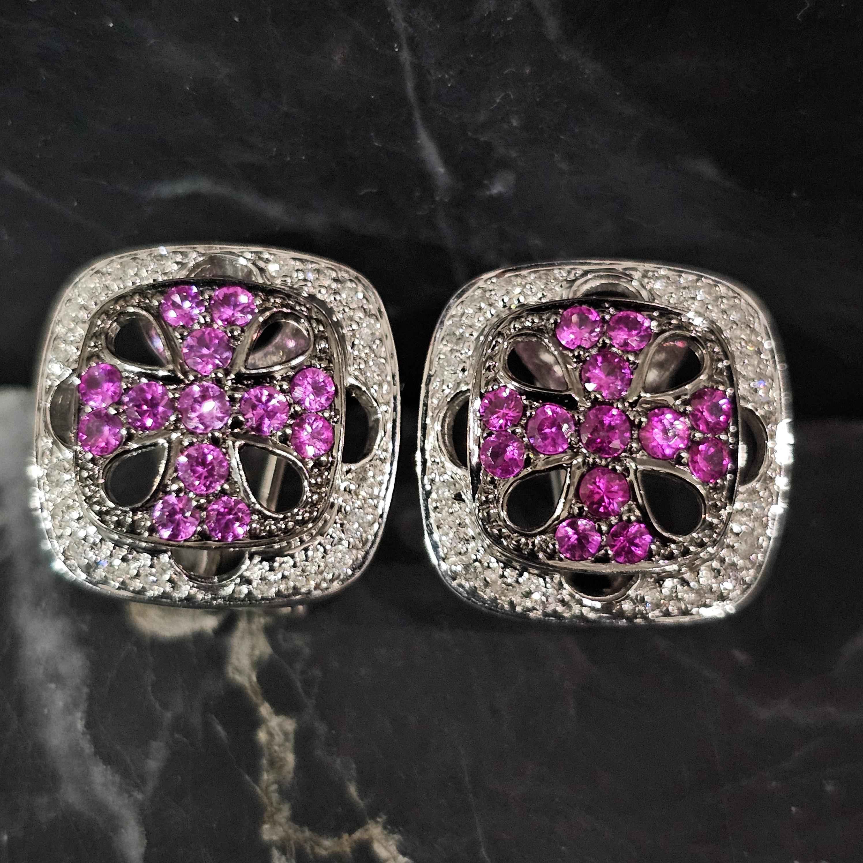 Presenting a stunning pair of Levian stud earrings crafted in 18k white gold.

These earrings feature a captivating design with vibrant pink sapphire stones, each cut in a round shape, forming a striking pattern. Surrounding the sapphires are