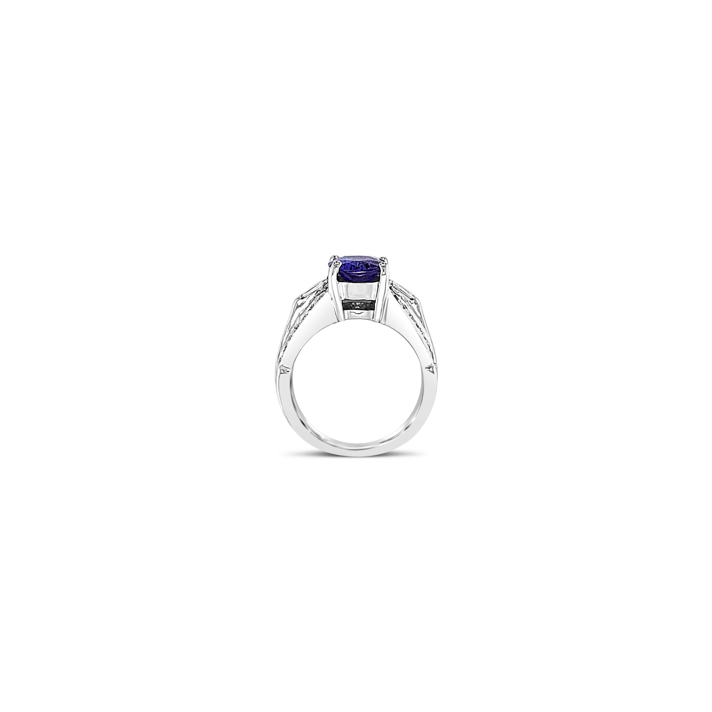 Upwards of 2 Carats of Tanzanite and White Diamonds, this LeVian Ring is set in 14K White Gold. Ring may or may not be sizable and is in great condition. Ring Size 5.5. Comes with Authentic LeVian Box and Pouch!
