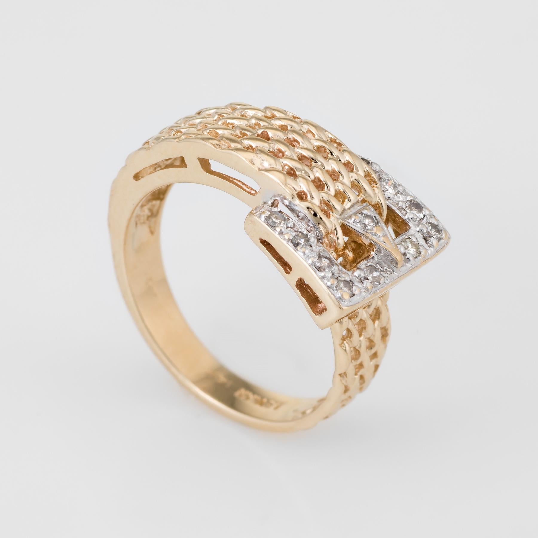 Finely detailed LeVian diamond buckle ring, crafted in 14 karat yellow gold. 

Diamonds total an estimated 0.11 carats (estimated at G-H color and VS2-SI1 clarity).   

The ring is in excellent condition. 

Particulars:

Weight: 4.9 grams

Stones: 