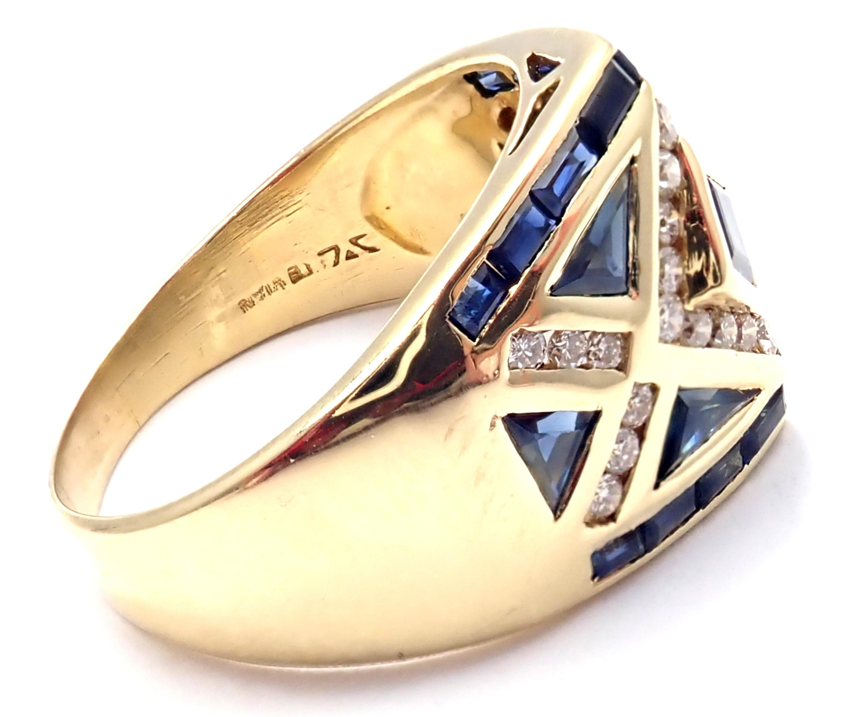 18k Yellow Gold Blue Sapphire & Diamond Band Ring by Levian.
With 28x round brilliant cut diamonds total weight approx. 0.35ctw
Blue Sapphires
Details: 
Size 9
Weight: 8.5 grams
Width: 14.5mm
Stamped Hallmarks: LeVian 18k
*Free Shipping within the