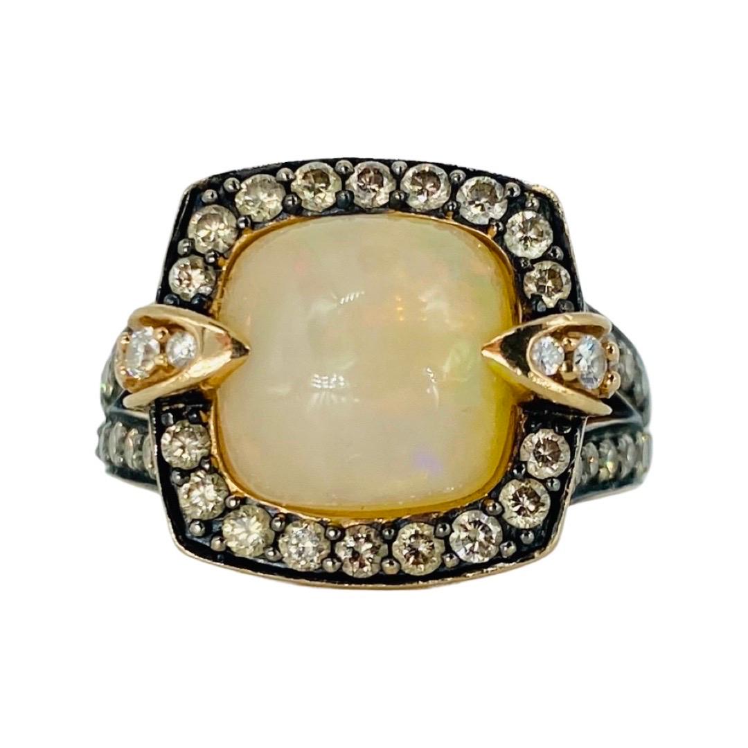 LeVian Large Neopolitan Opal, Diamond s and Amethyst Ring 14k Strawberry Gold. Stunning work of art by LeVian designer. The center Opal stone measures approx 11x9mm and the diamonds weight approx 0.78tcw & amethyst stones approx 0.22tcw
The ring is