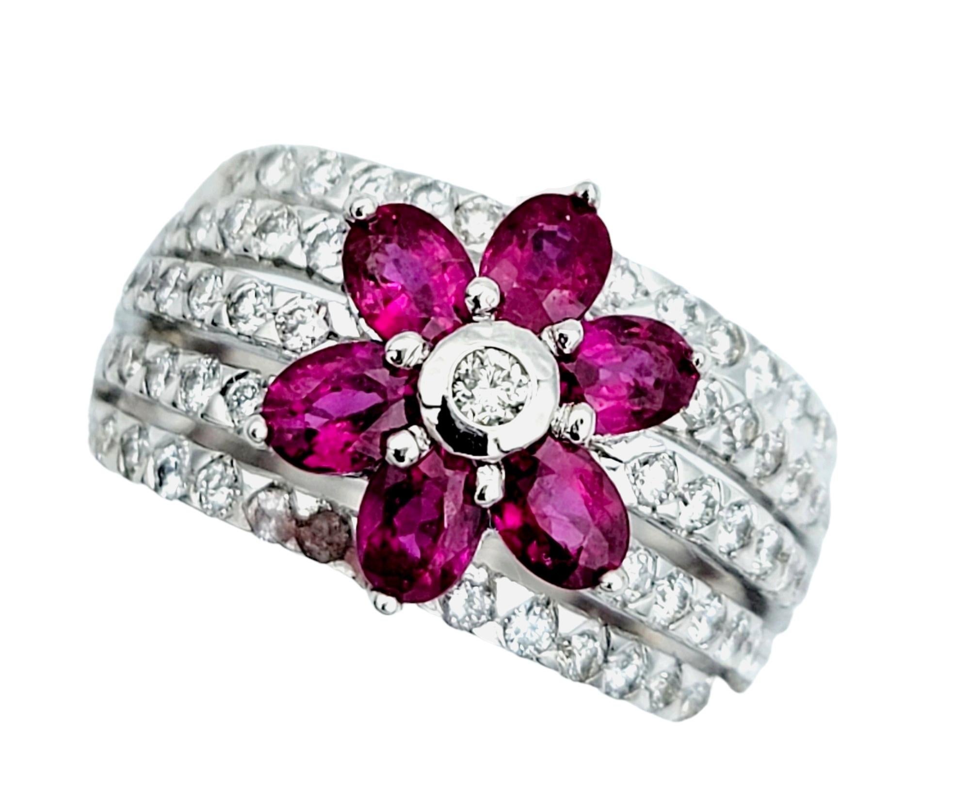 Ring Size: 6.75 

Enhance your fine jewelry collection with the allure of this gorgeous Le Vian multi row diamond ring featuring a captivating ruby and diamond flower motif at its heart. This exquisite masterpiece combines artistry and luxury in a