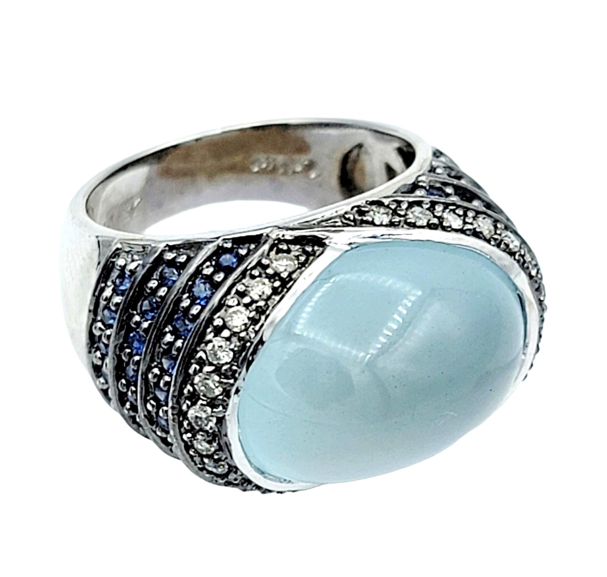Ring Size: 5 

Elevate your style with this exquisite 14 karat white gold cocktail ring by Le Vian. A mesmerizing oval moonstone cabochon takes center stage, showcasing its ethereal adularescence that shimmers with every movement. The moonstone's