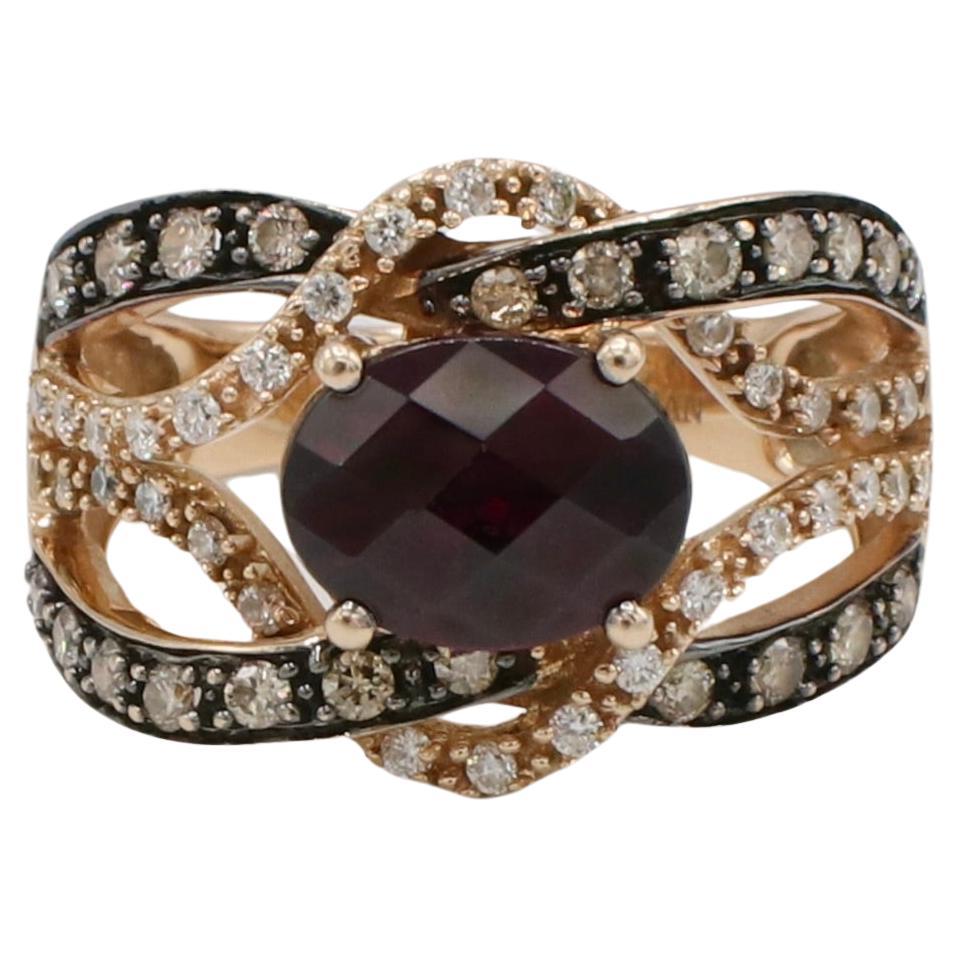 LeVian Rhodolite Garnet and Natural Diamond Wrap Cocktail Band Ring 
Metal: 14k rose gold
Weight: 6.35 grams
Garnet: 7 x 9mm
Diamonds: Approx. ,40 CTW brown and G-H SI round diamonds
Size: 6.75 (US)
Width: 3 - 14.5mm
Signed: LeVian 14k 
