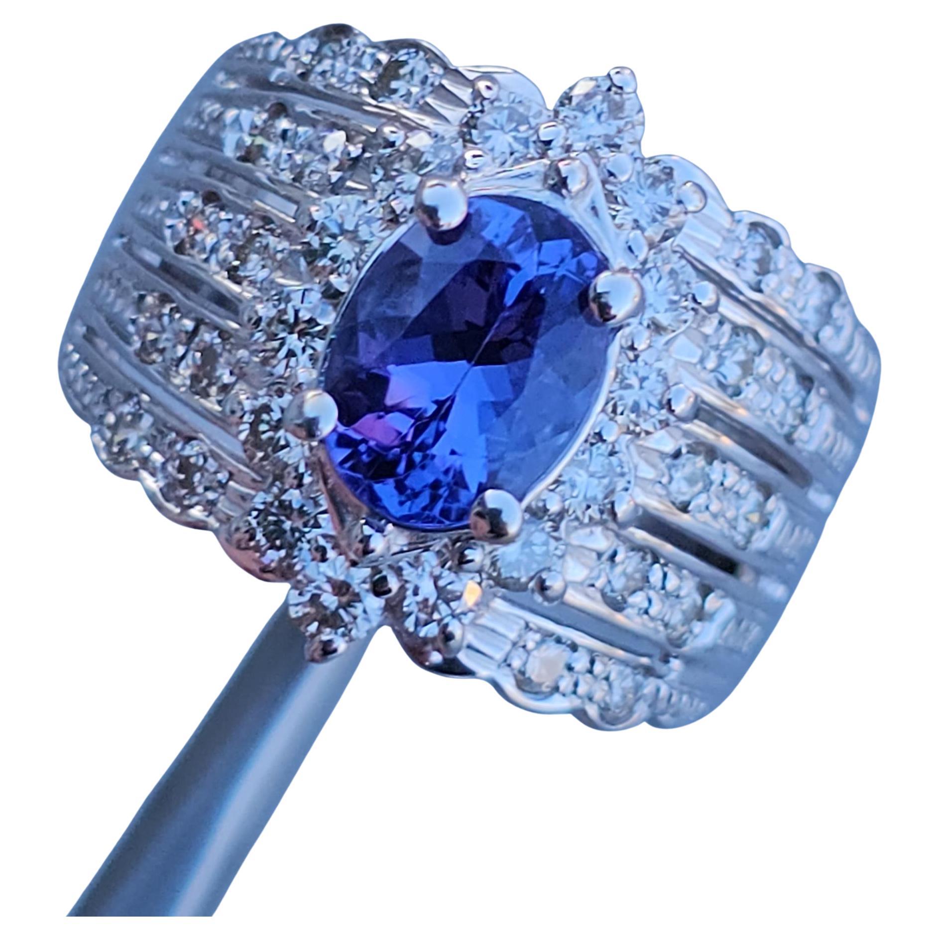 Here we have a Levian 18k white gold cocktail ring featuring a stunning tanzanite centerpiece.

Specifics
- Ring Size: 7.25
- Primary Stone: Oval-cut tanzanite, purple color
- Secondary Stone: Round-cut diamonds, light brown color
- Metal: 18k white