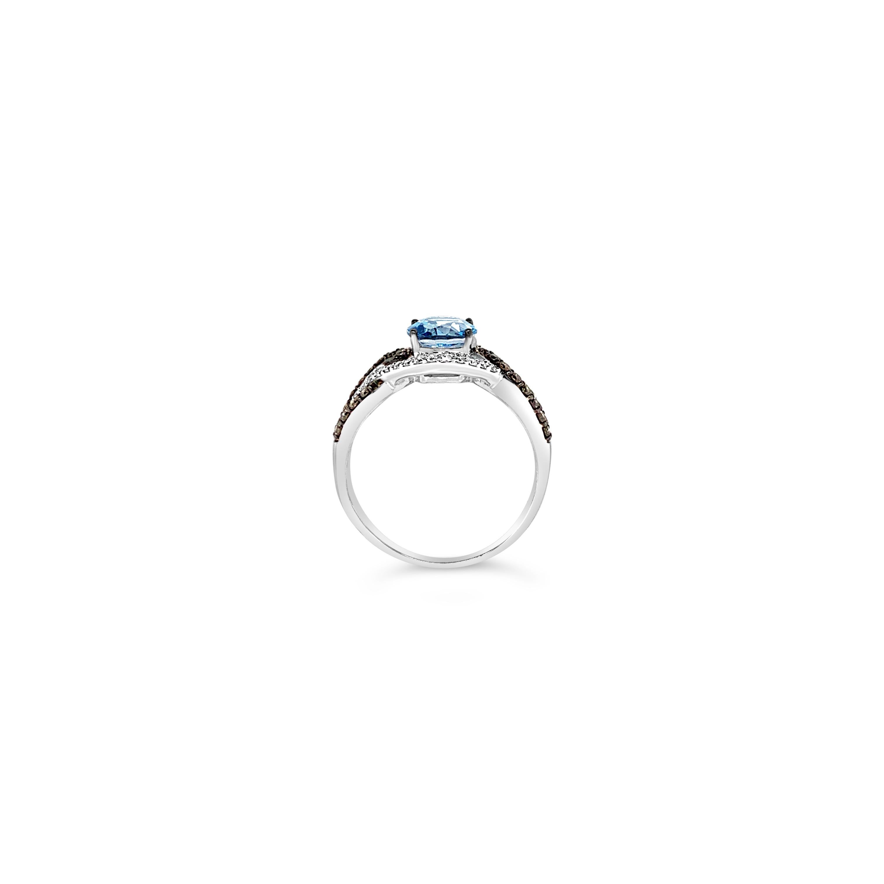 Le Vian® Ring featuring 2.30 cts. Ocean Blue Topaz, 0.30 cts. Chocolate Diamonds® , 0.22 cts. Vanilla Diamonds® set in 14K Vanilla Gold®

Diamonds Breakdown:
.30 cts Brown Diamonds
.22 cts White Diamonds

Gems Breakdown:
2.30 cts Blue Topaz

Ring