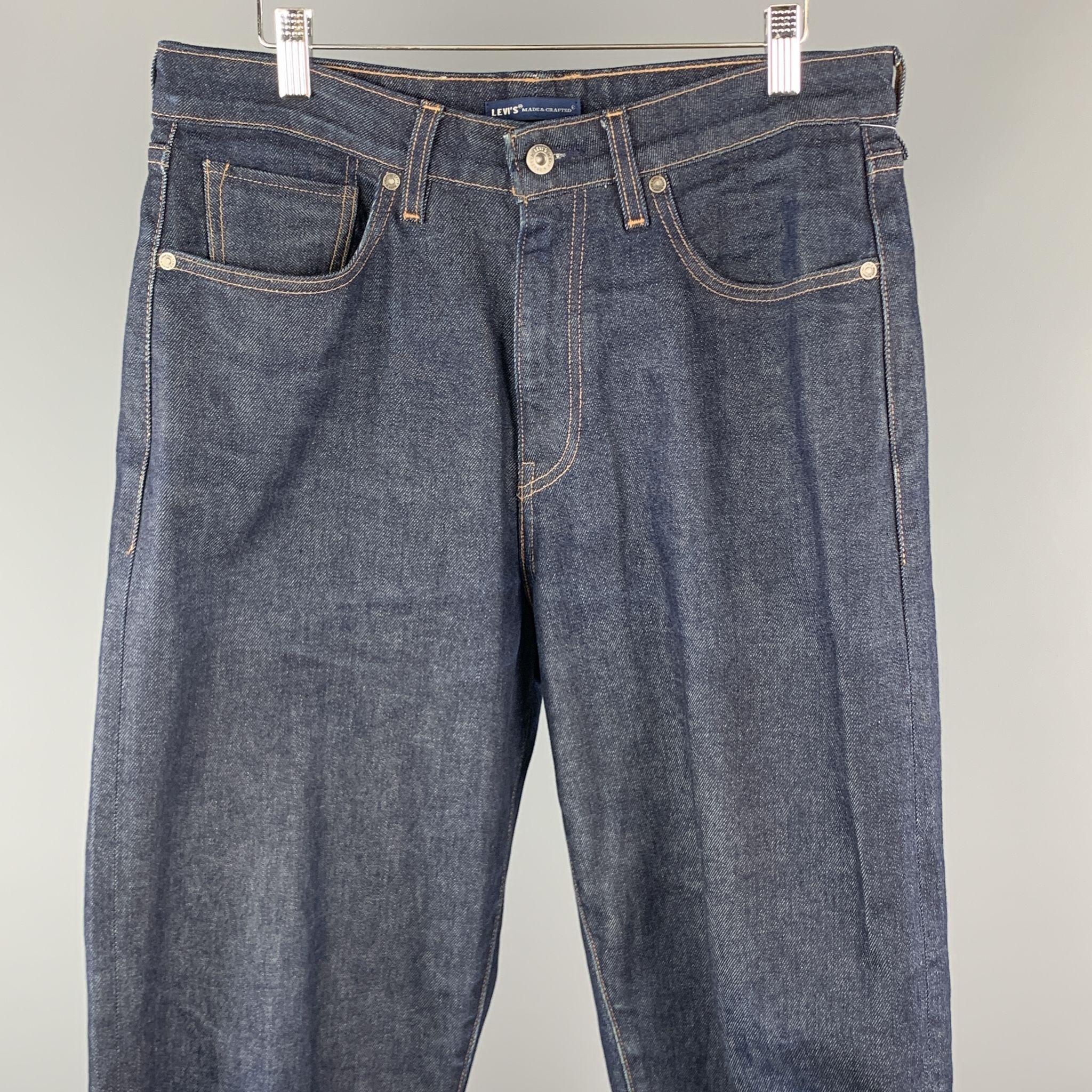 LEVI'S MADE & CRAFTED Jeans comes in a indigo washed selvedge denim featuring a cropped style and a zip fly closure. 

Excellent Pre-Owned Condition.
Marked: 32

Measurements:

Waist: 32 in. 
Rise: 12 in. 
Inseam: 23 in. 

SKU: 98217
Category: