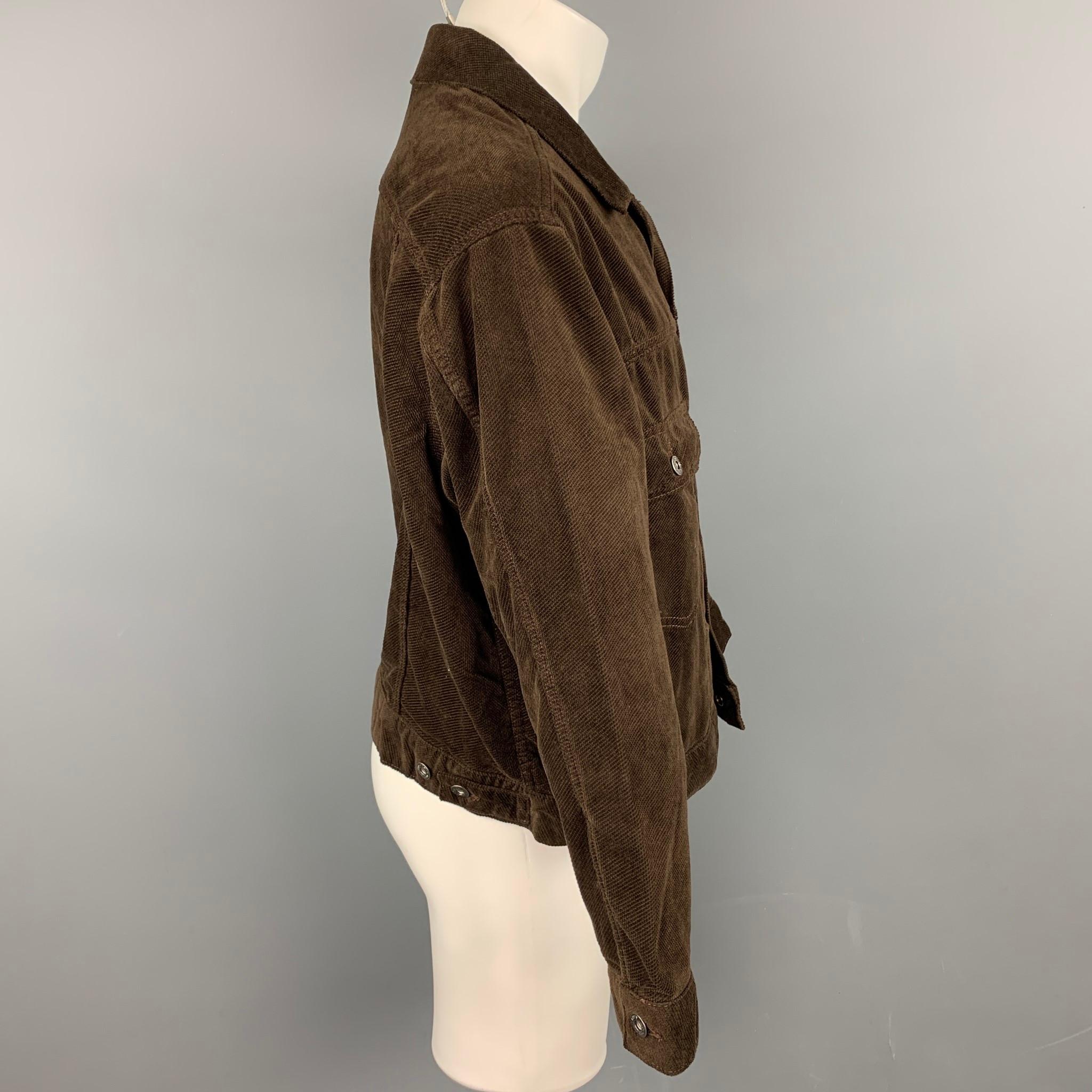 LEVI'S MADE & CRAFTED jacket comes in a brown corduroy cotton featuring a trucker style, relaxed fit, patch pockets, spread collar, and a buttoned closure.

Good Pre-Owned Condition.
Marked: M

Measurements:

Shoulder: 21 in.
Chest: 46 in.
Sleeve: