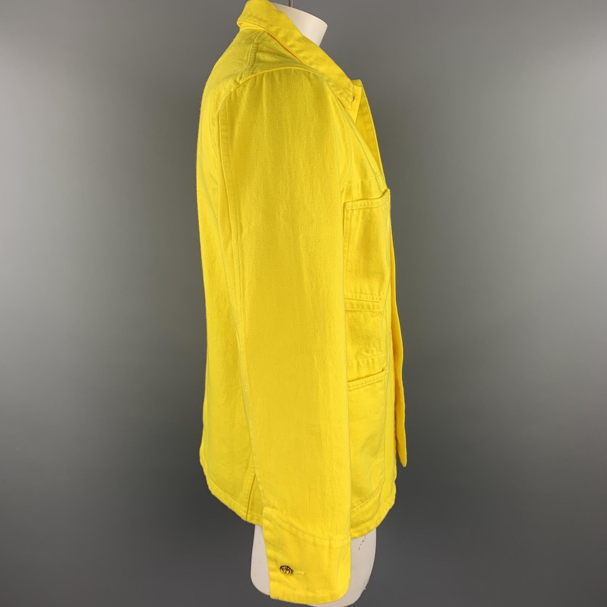 LEVI'S MADE & CRAFTED jacket comes in a yellow cotton featuring a worker style, front patch pockets, spread collar, and a buttoned closure. Made in Japan.

Very Good Pre-Owned Condition.
Marked: M

Measurements:

Shoulder: 18 in.
Chest: 44 in.